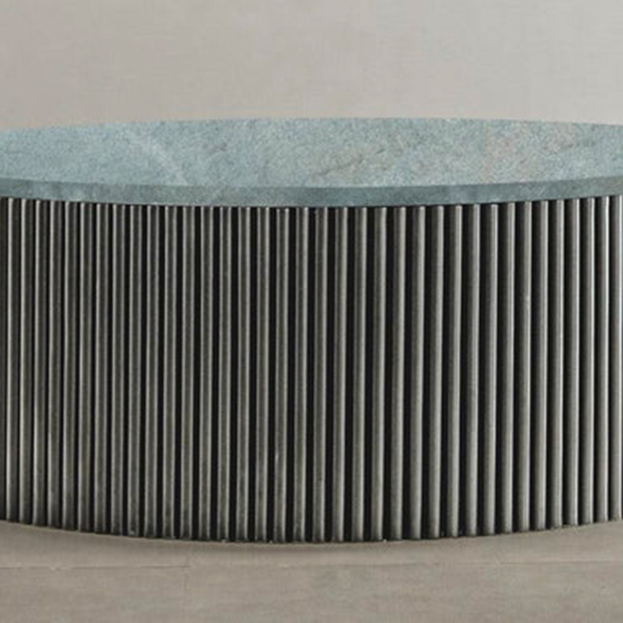 "Sophisticated circular coffee table with unique ribbed pattern"