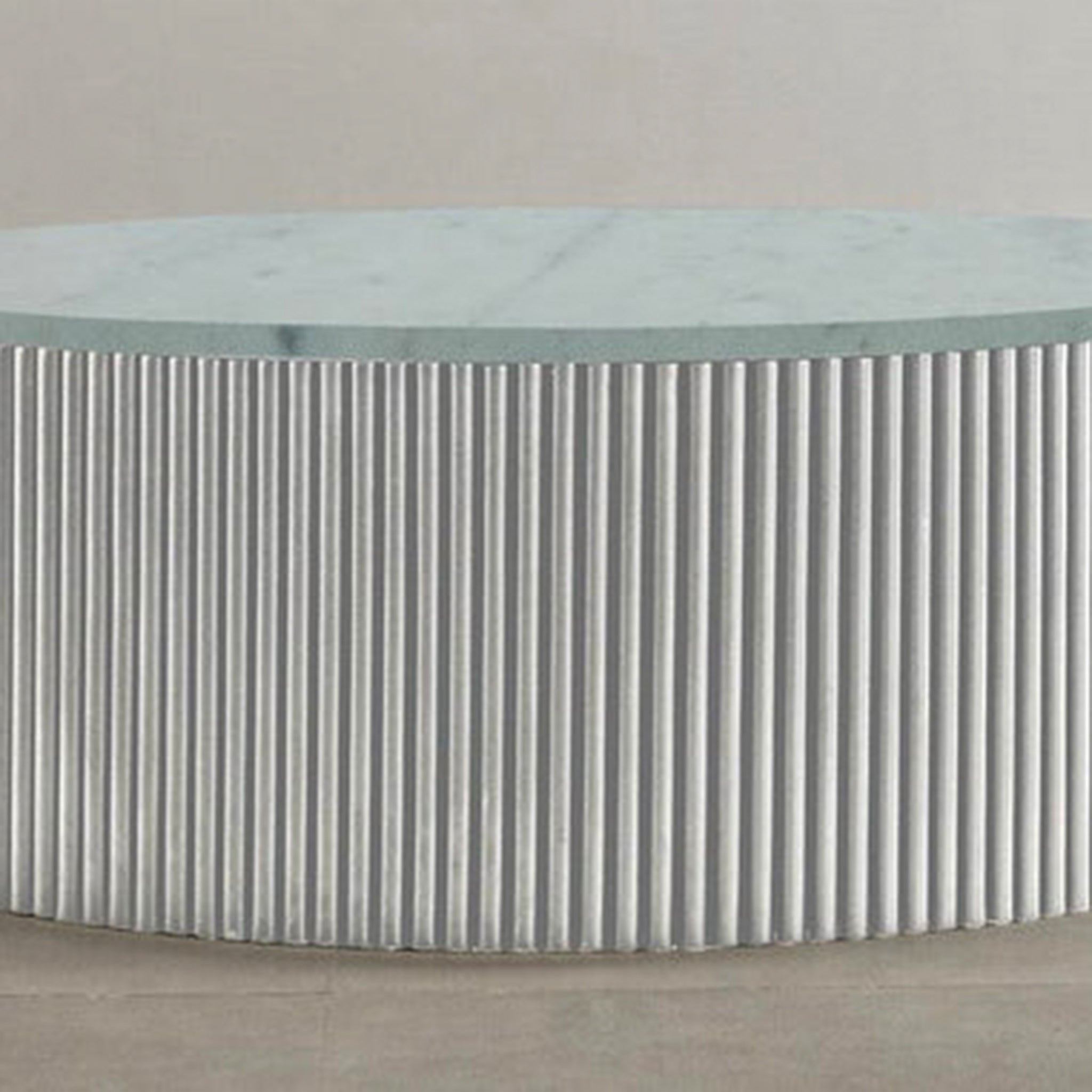 "Modern coffee table with ribbed sides and smooth top"