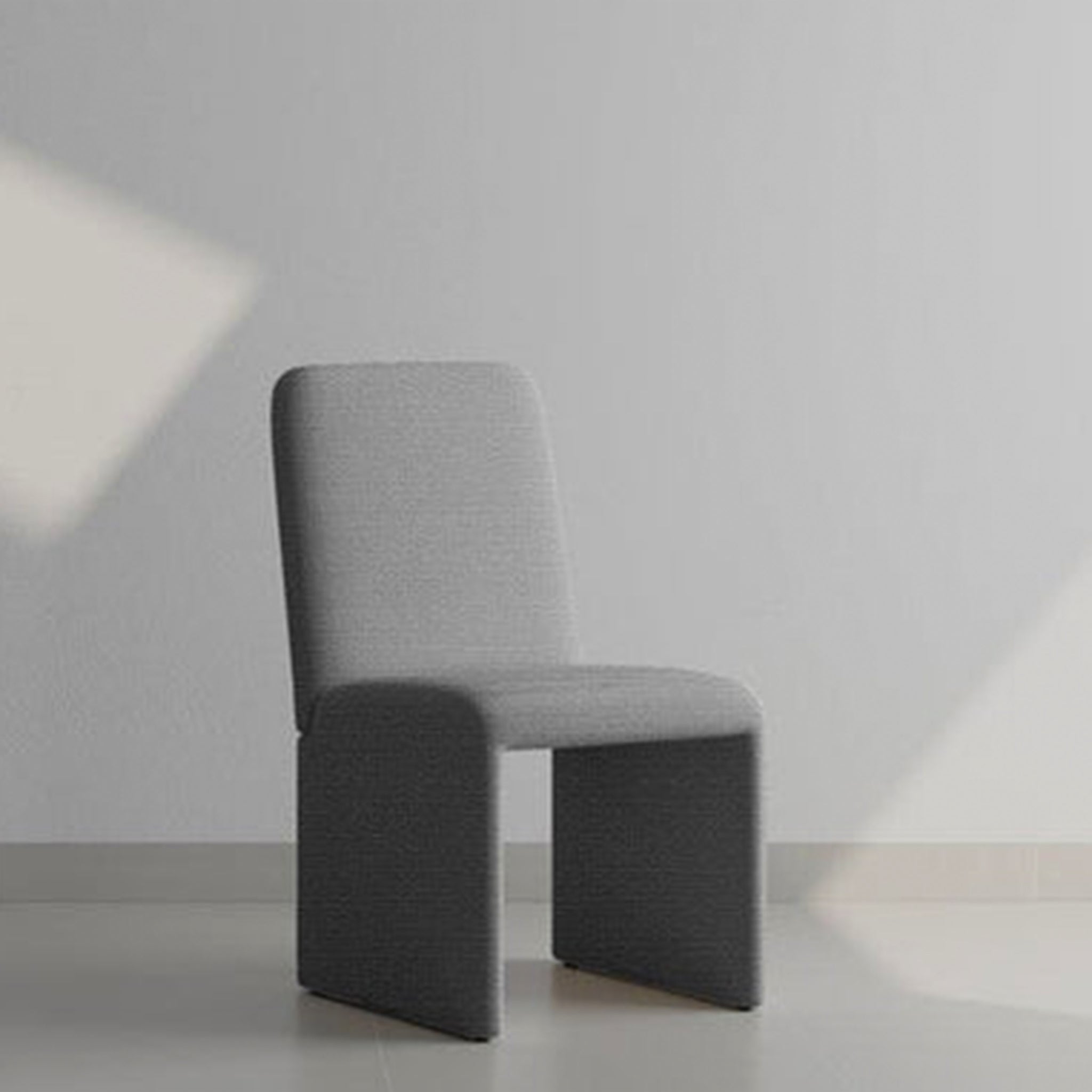 The Carl Chair in off-white upholstery with minimalist design