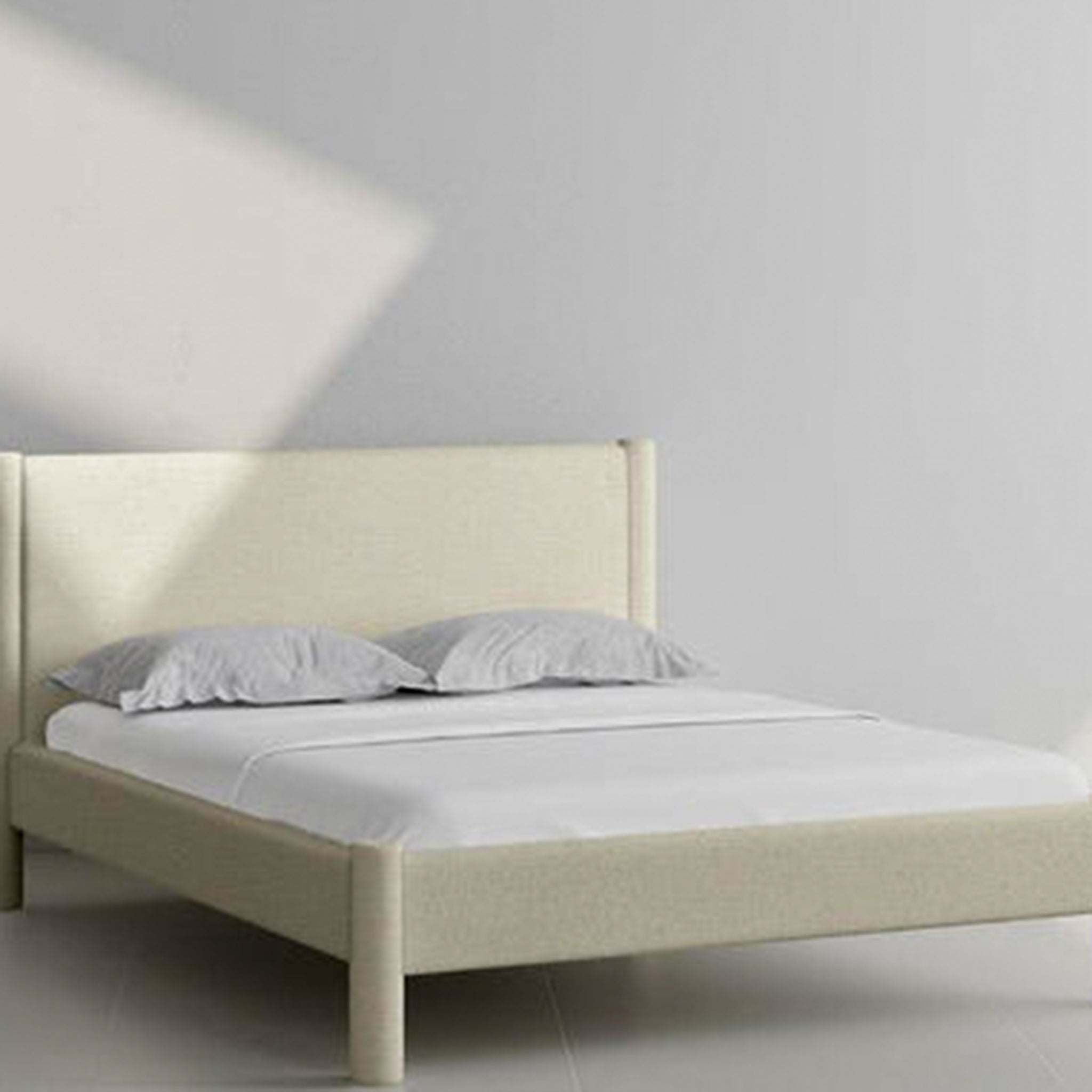 The Carrie Bed with solid beech wood legs and turquoise upholstery, ideal for contemporary decor.