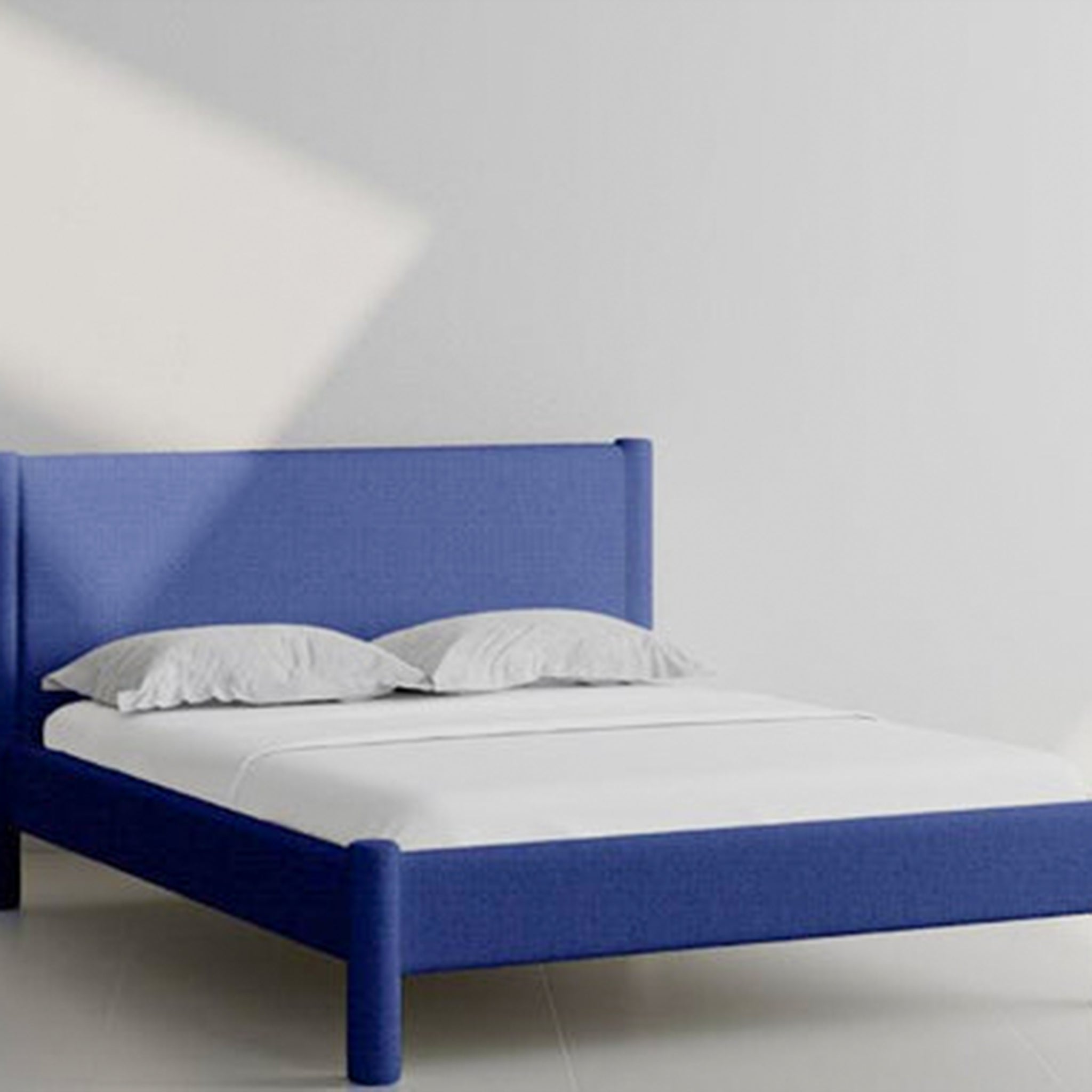 Modern and vibrant blue Carrie Bed, available in various sizes.