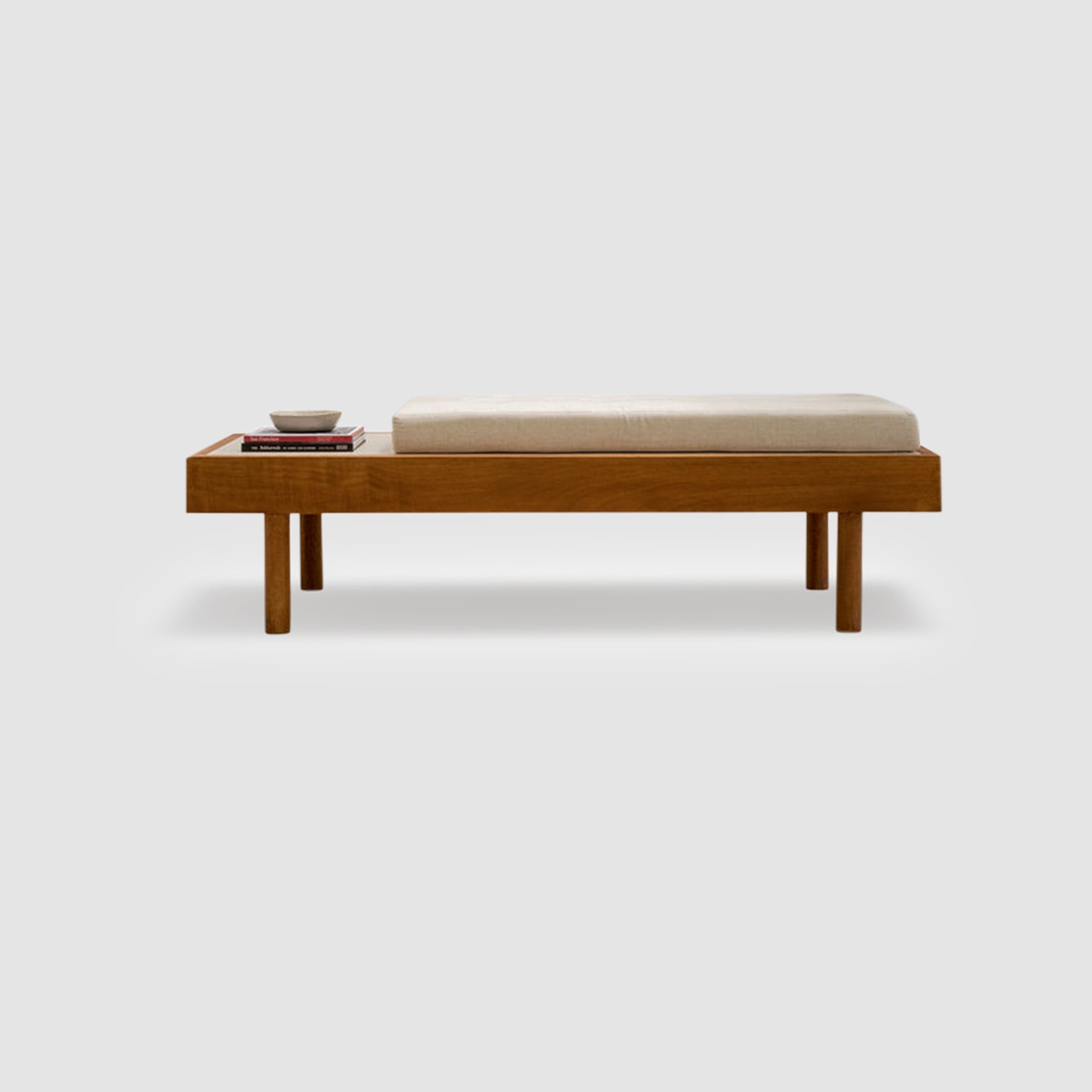 Modern wooden daybed with a customizable cushion and a side tray, placed on a white background