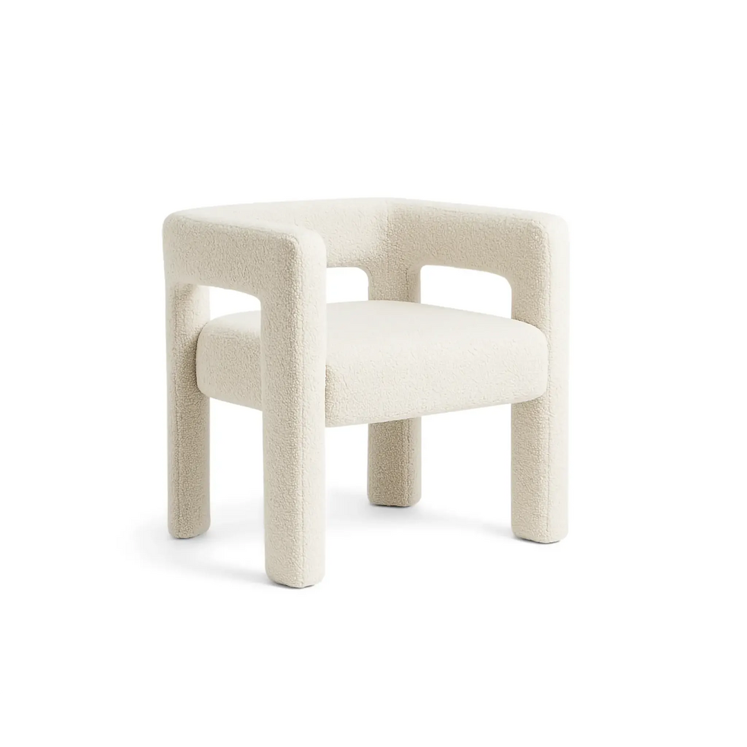The Celeste Accent Chair in a minimalist living room setting, with soft, textured fabric and modern design, perfect for contemporary home decor.