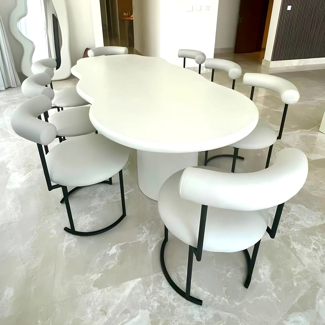 Elegant round dining chair, showcasing a minimalist silhouette with a comfortable seat and sturdy frame.