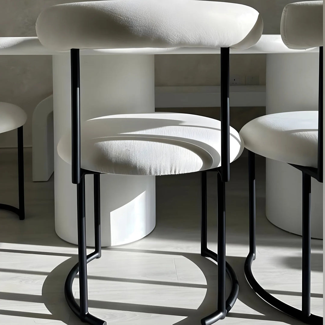 The Claudia round dining chair, combining comfort and modern elegance in your dining space.