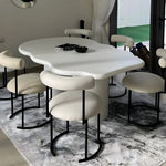 Load image into Gallery viewer, A modern round dining chair, adding a touch of sophistication to your dining room setup.
