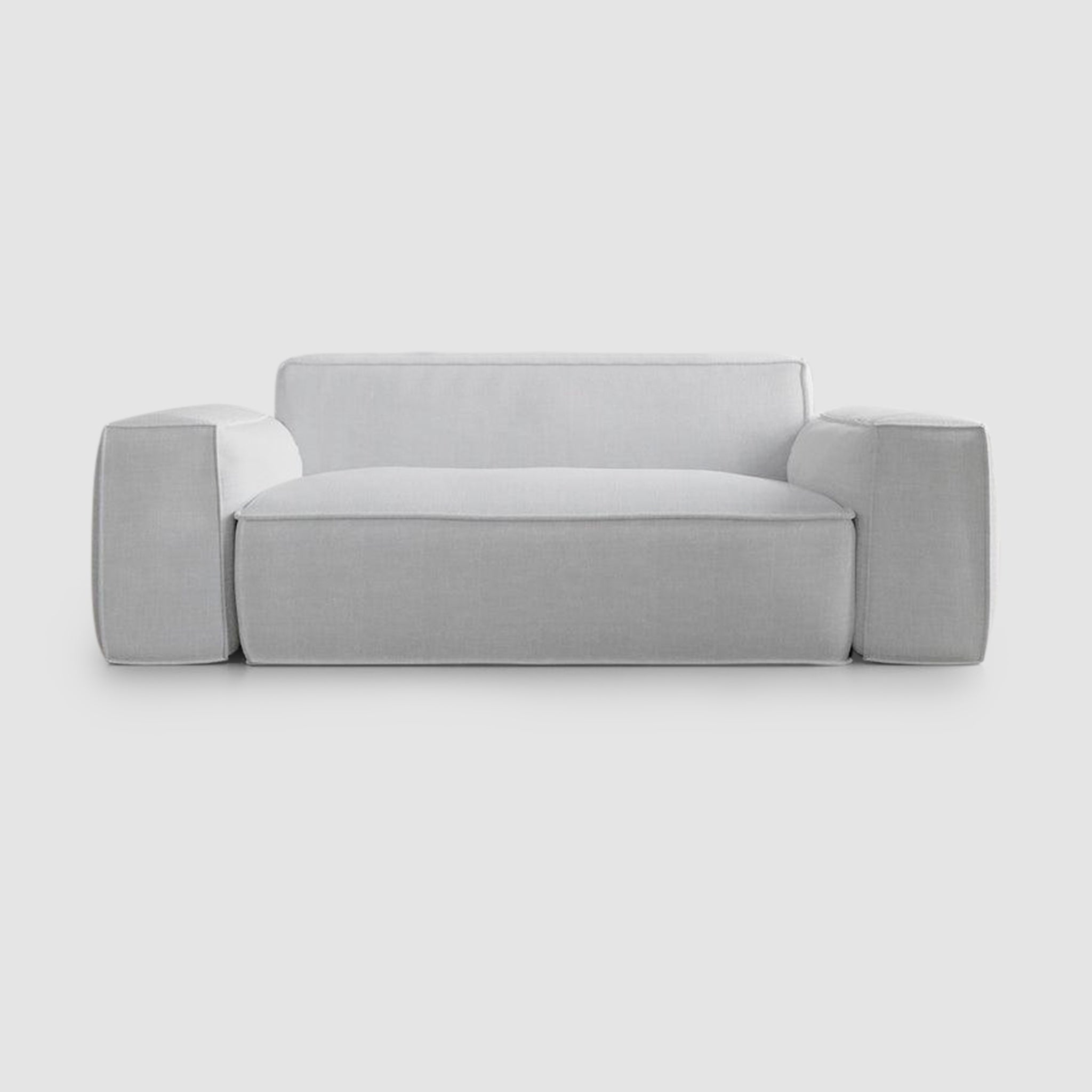 Simple and modern white sofa with inviting plush cushions.