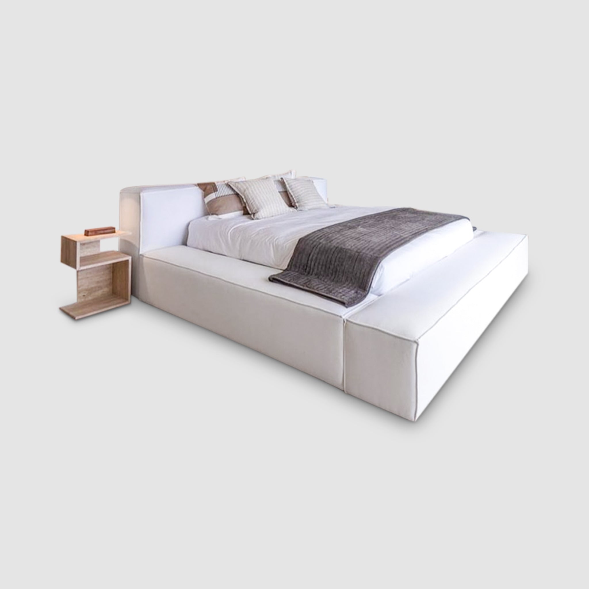 Luxurious white platform bed with a modern nightstand. Perfect for a minimalist bedroom.