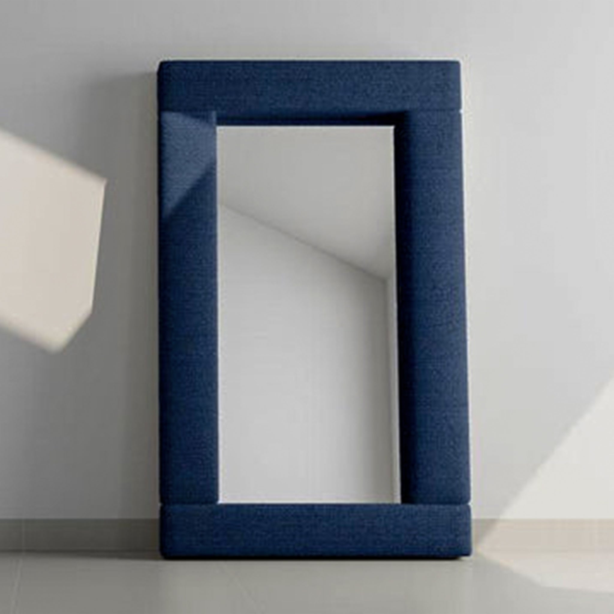 Modern rectangular mirror framed in navy blue fabric. standing mirror dubai