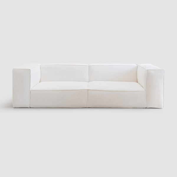 Front view of a minimalist white modular couch with wide armrests and plush cushions, perfect for modern living room decor. Buy 2 seater Customizable Damien Modular Couch sofa