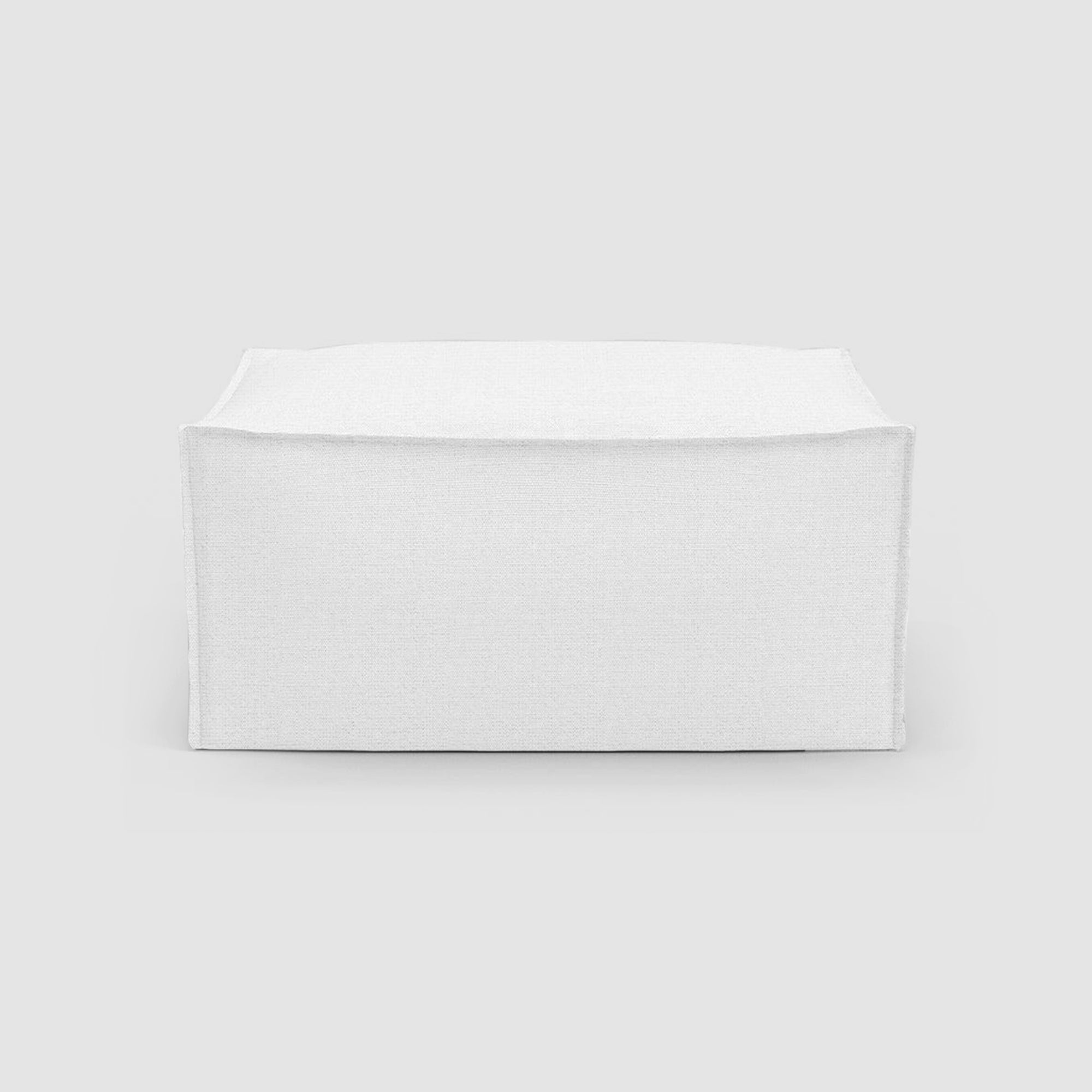 White modern ottoman, ideal for adding a minimalist touch to any living space.