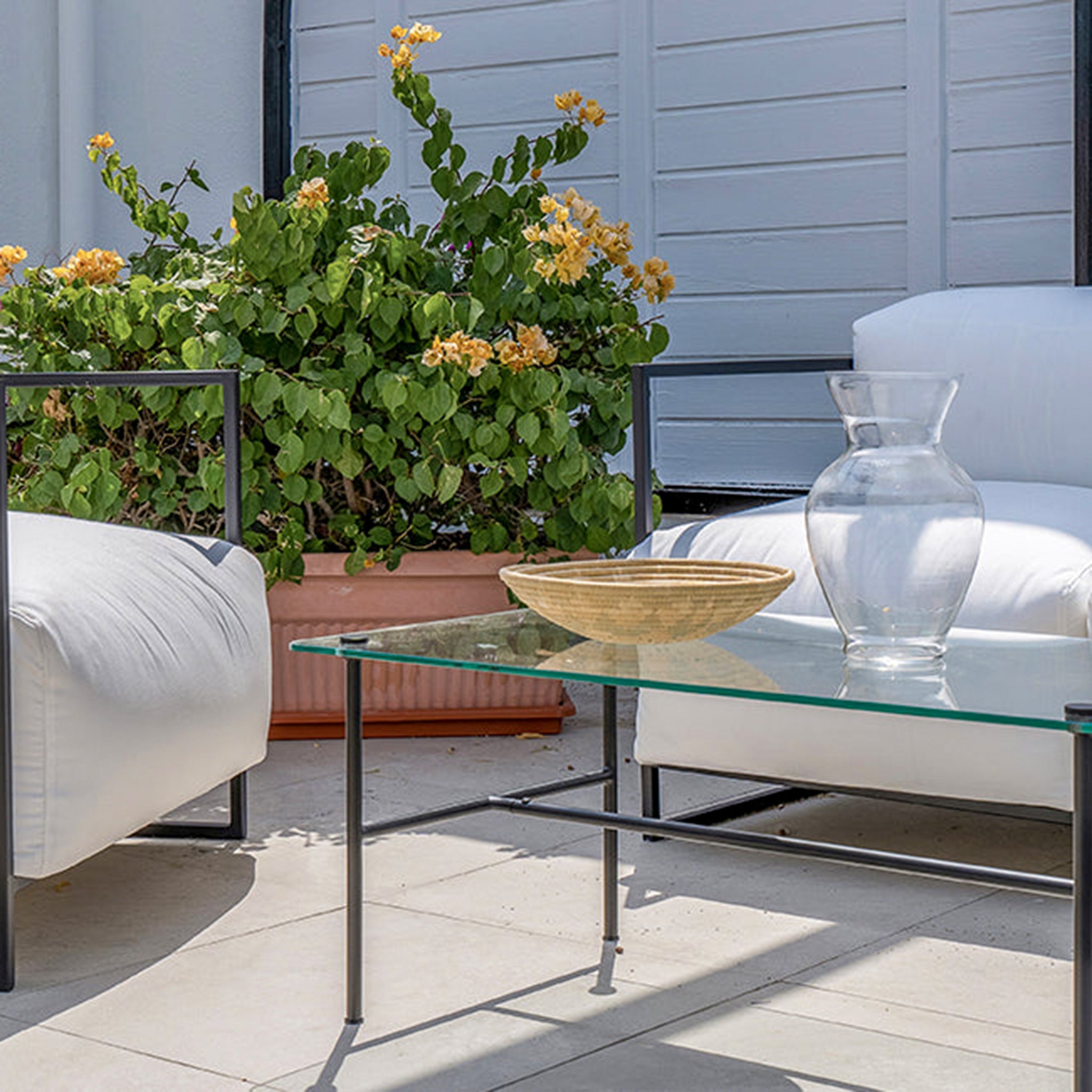 Weatherproof white Dexter outdoor sofa in UV-protected fabric for lasting comfort on your patio.