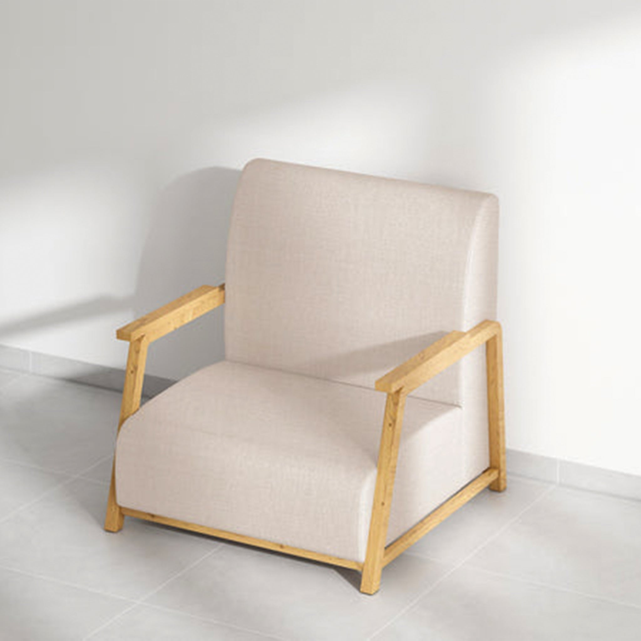Angled top view of The Dixon Arm Accent Chair, highlighting its beige upholstery and robust natural wooden armrests, set against a minimalist background.