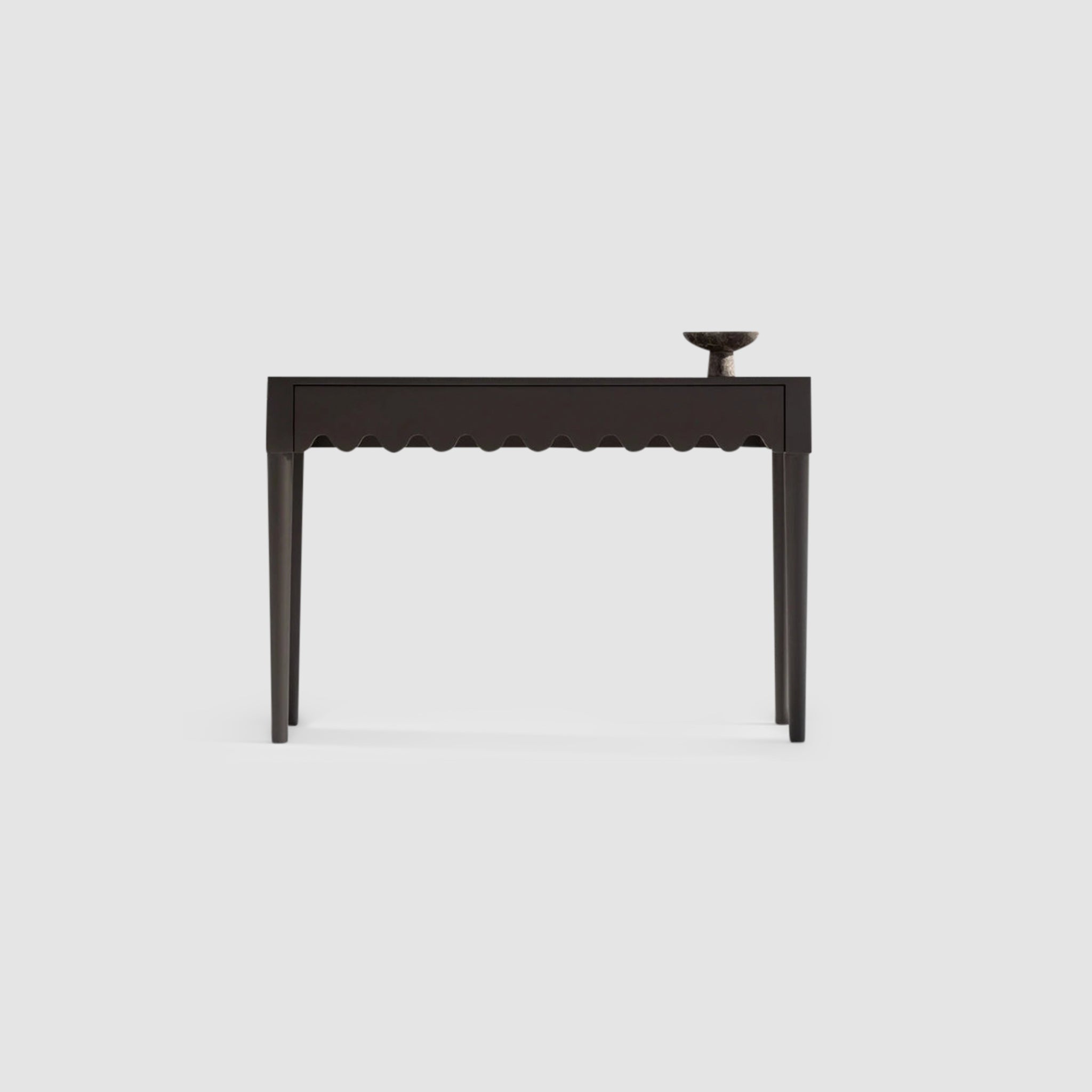 "The Dolores Console with a sleek modern design and a curvy bottom drawer."