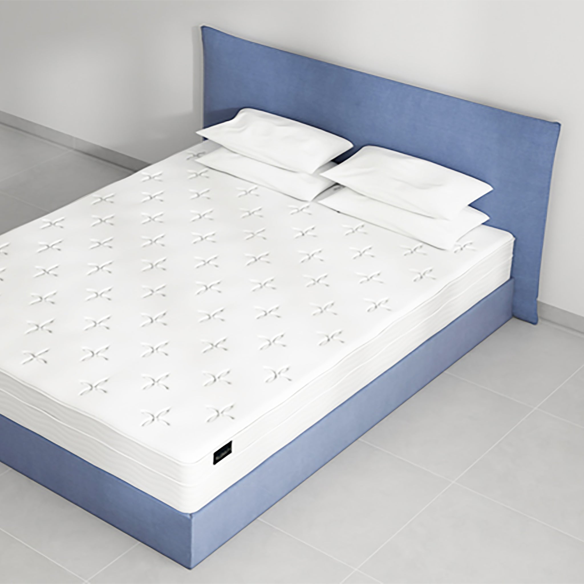 Plush white EuroTop mattress with a knitted top rests on a wooden platform bed frame. The Douglas EuroTop Mattress is 30cm thick and offers pressure relief with its supportive core.