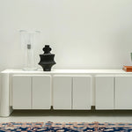 Load image into Gallery viewer, White TV stand with a seamless finish, offering both utility and a modern look in family homes.
