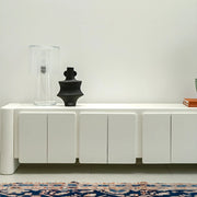 White TV stand with a seamless finish, offering both utility and a modern look in family homes.