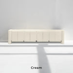 Load image into Gallery viewer, he Dustin cream TV unit styled in a minimalist living room, combining elegance and practicality.
