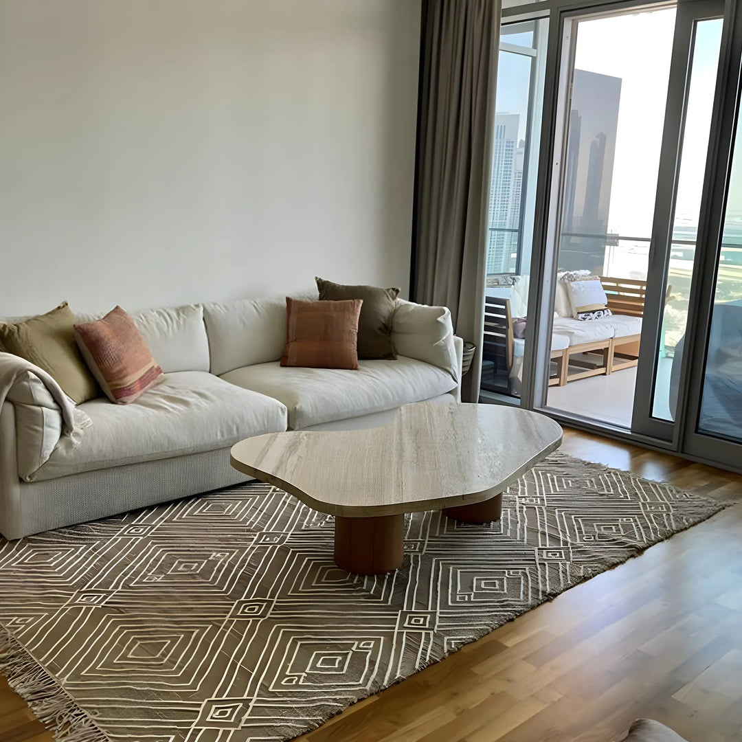 The Eliza Coffee Table with a white marble top, showcasing sophistication in a beautifully styled UAE living room.