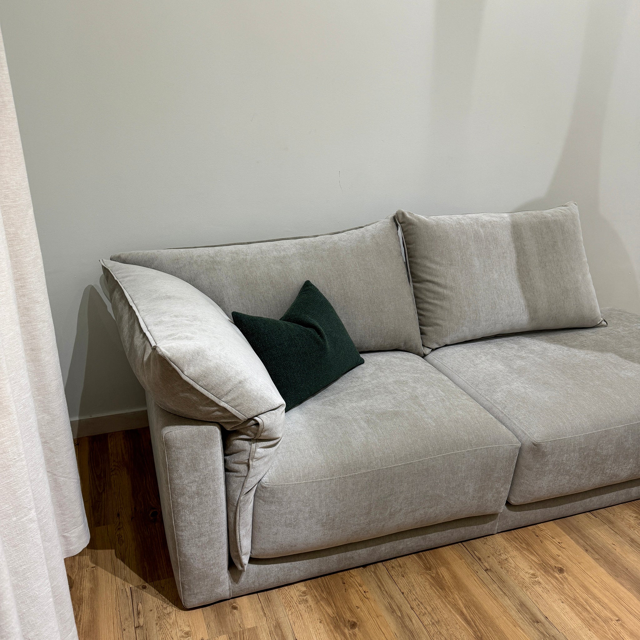 Gray plush Constance sofa in living room with wooden floor, perfect for relaxation