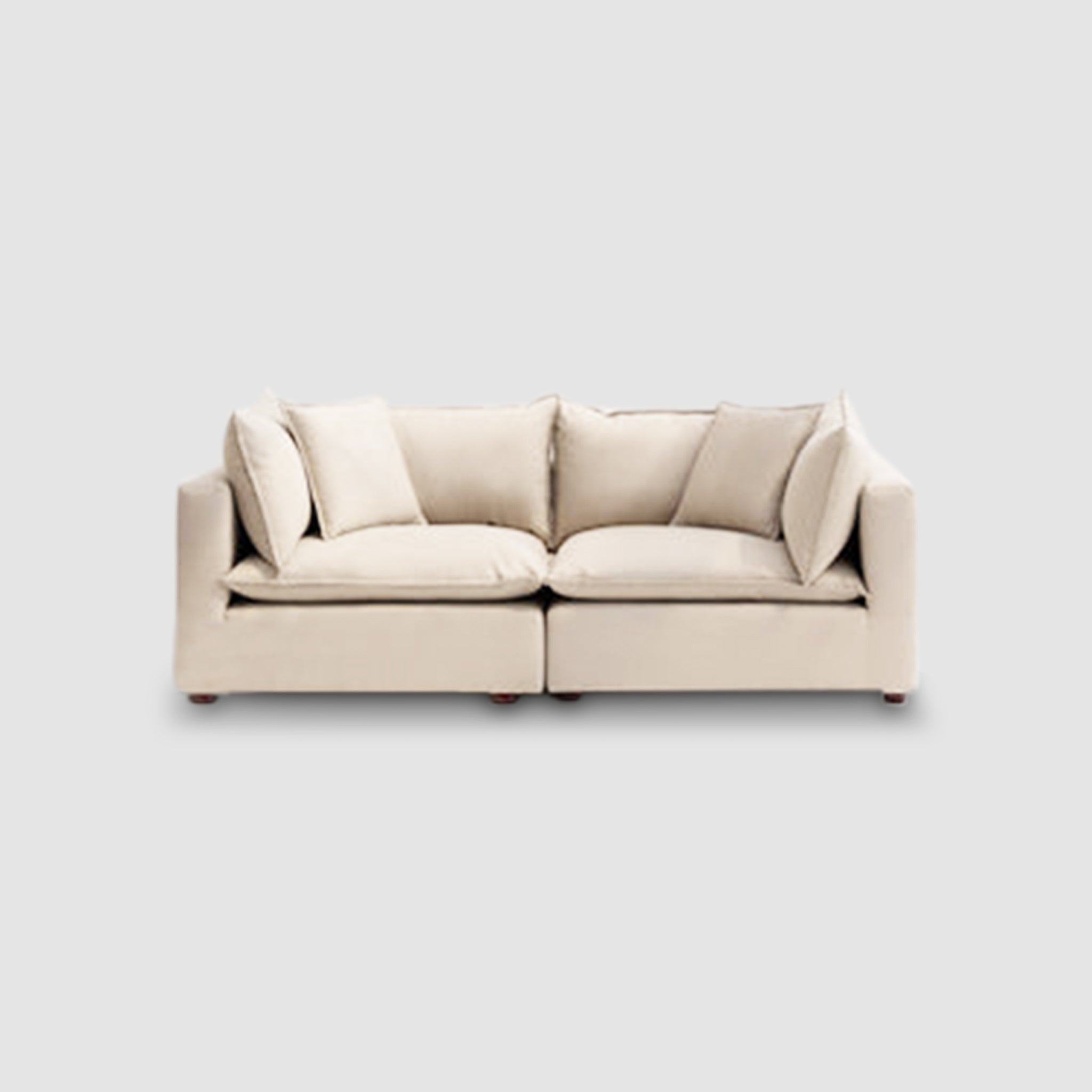 Beige loveseat sofa with plush cushions, ideal for small living spaces and modern home decor.