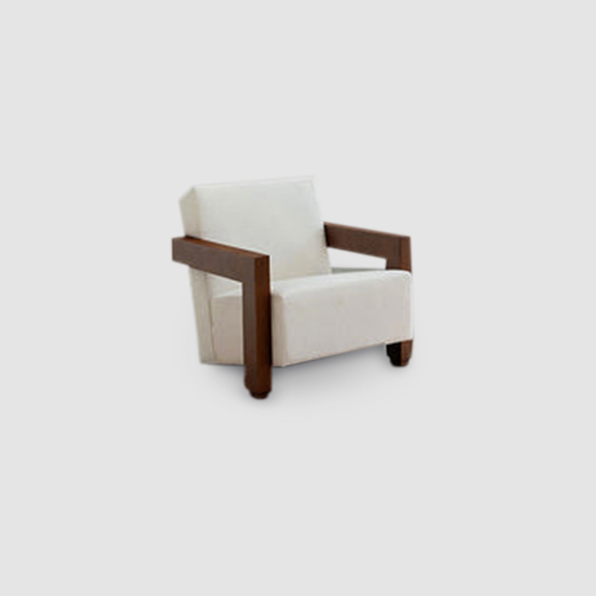 Angled view of The Gerrit Accent Chair featuring white upholstery and robust wooden armrests, set against a plain background.