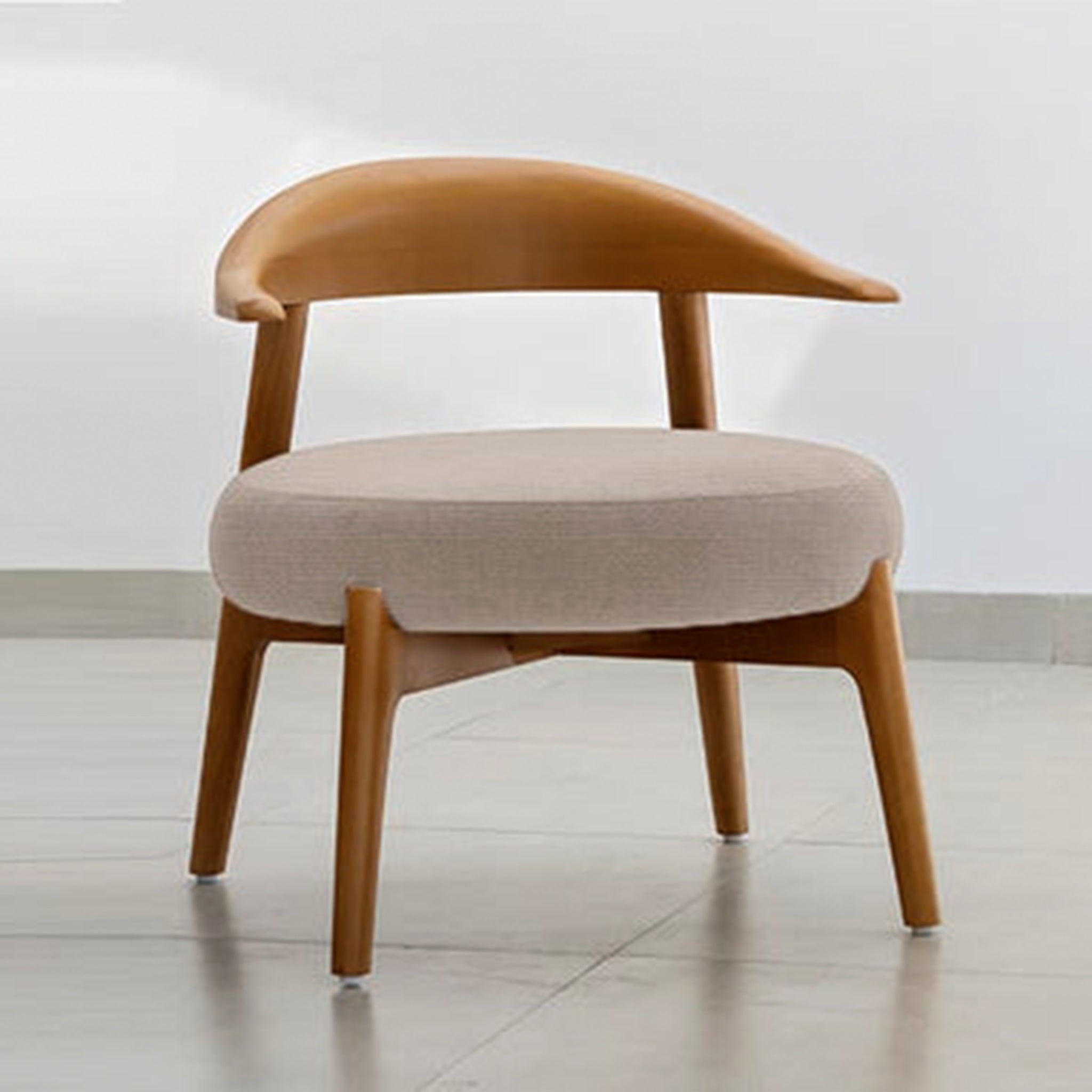 "The Hyde Accent Chair with its unique wooden frame and plush blue seat"