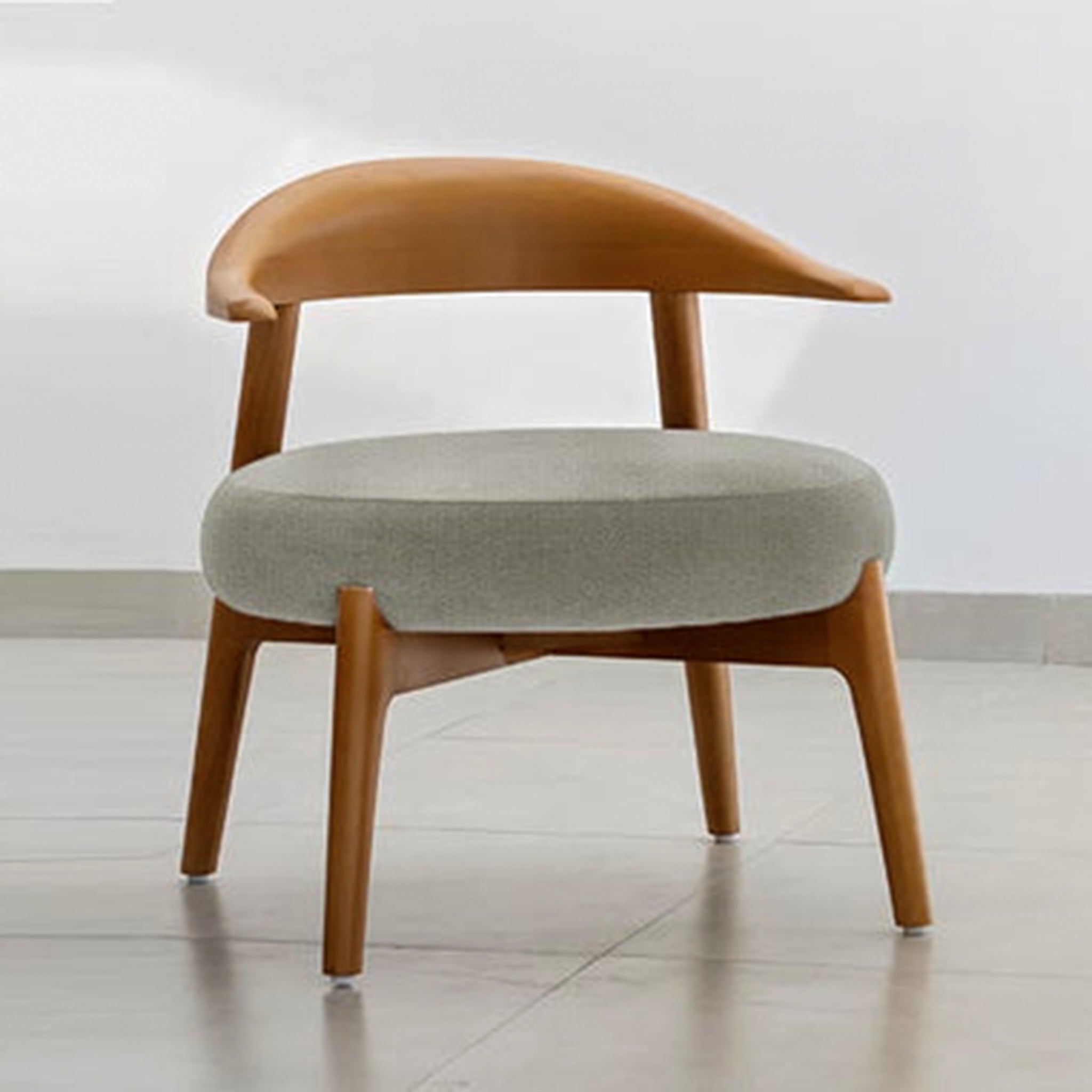 "The Hyde Accent Chair with elegant wooden design and plush seat"