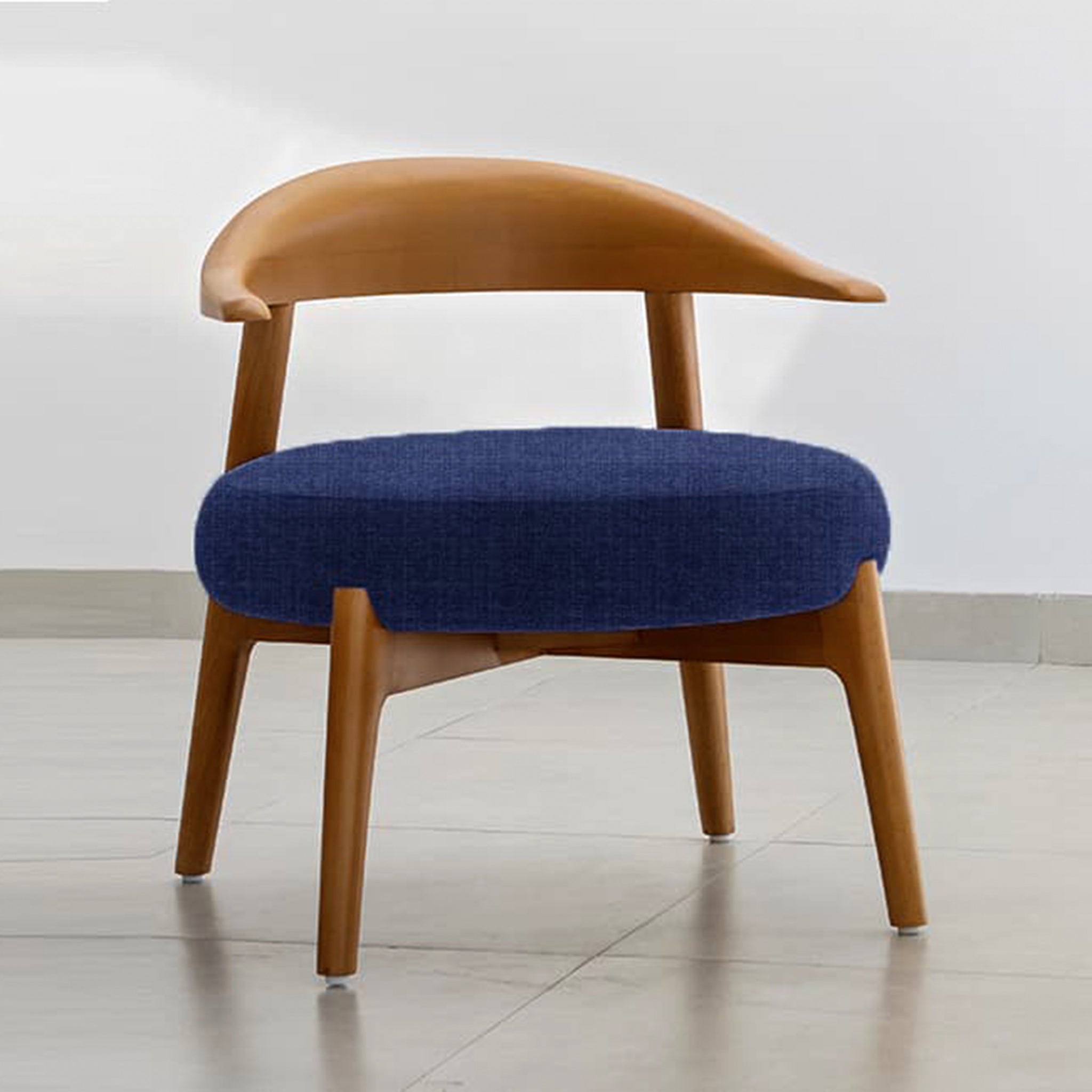 "The Hyde Accent Chair with elegant wooden curves and plush seating"
