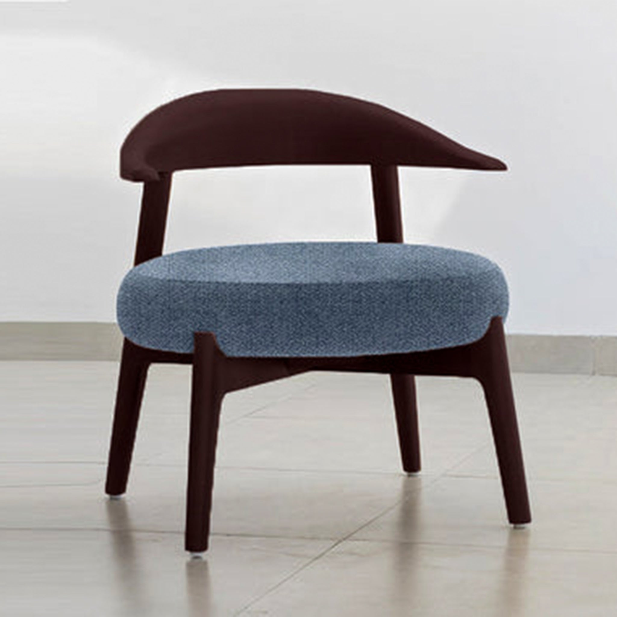 "The Hyde Accent Chair with sleek wooden backrest and plush blue seat"