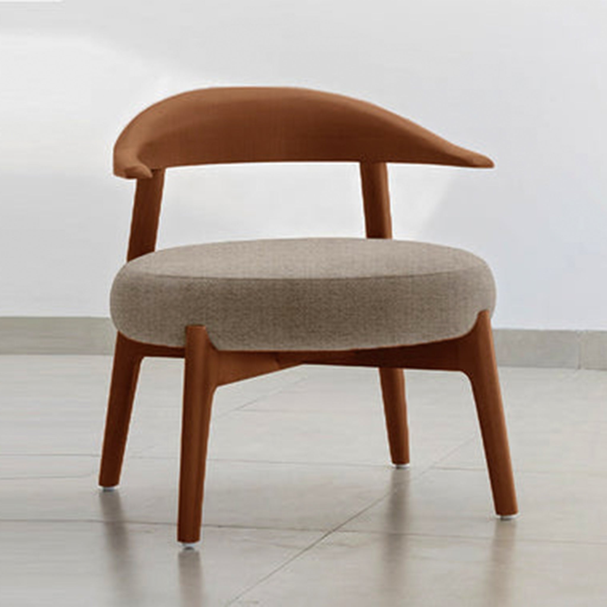 "The Hyde Accent Chair with sleek wooden curves and cozy fabric"