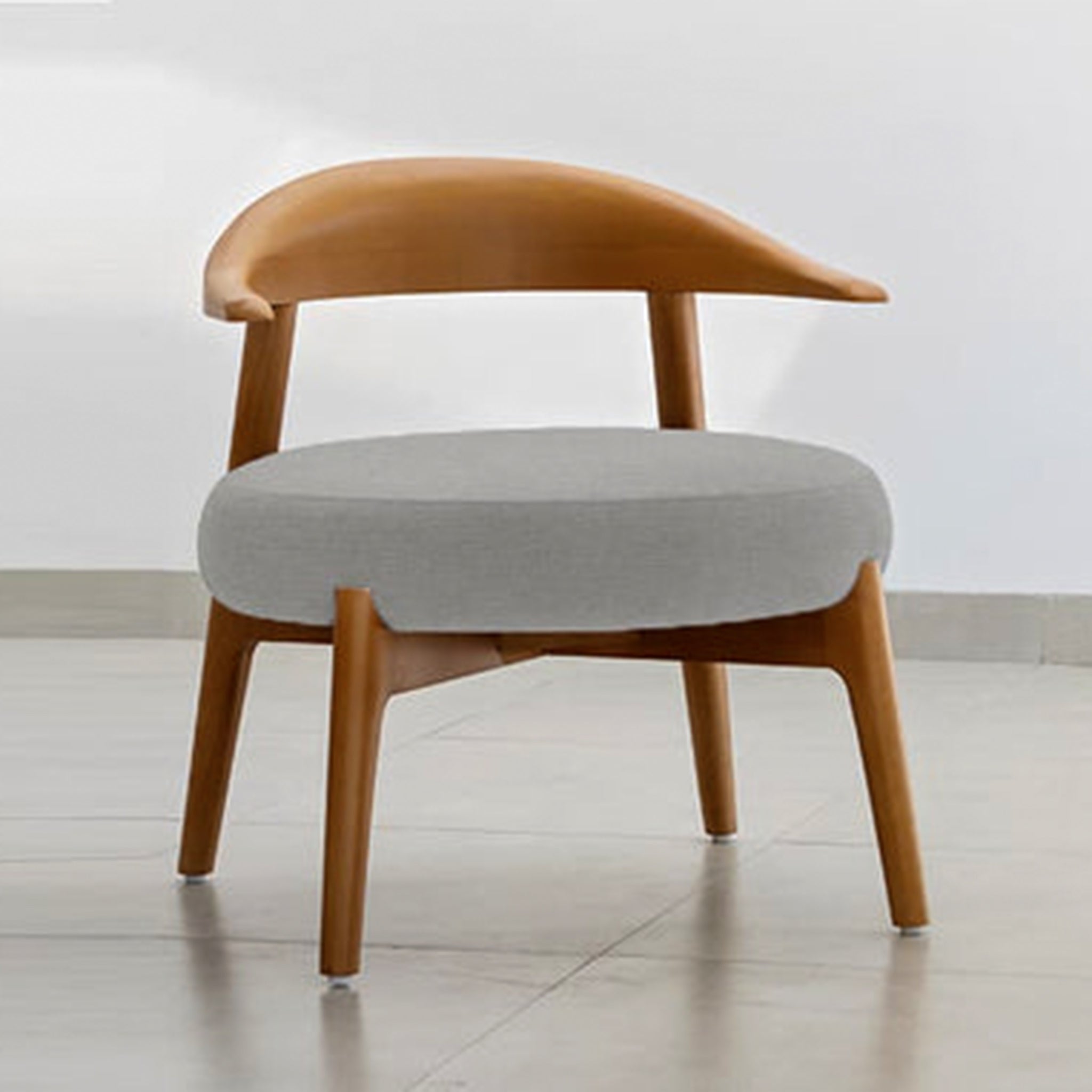 "The Hyde Accent Chair with elegant wooden frame and plush seating"