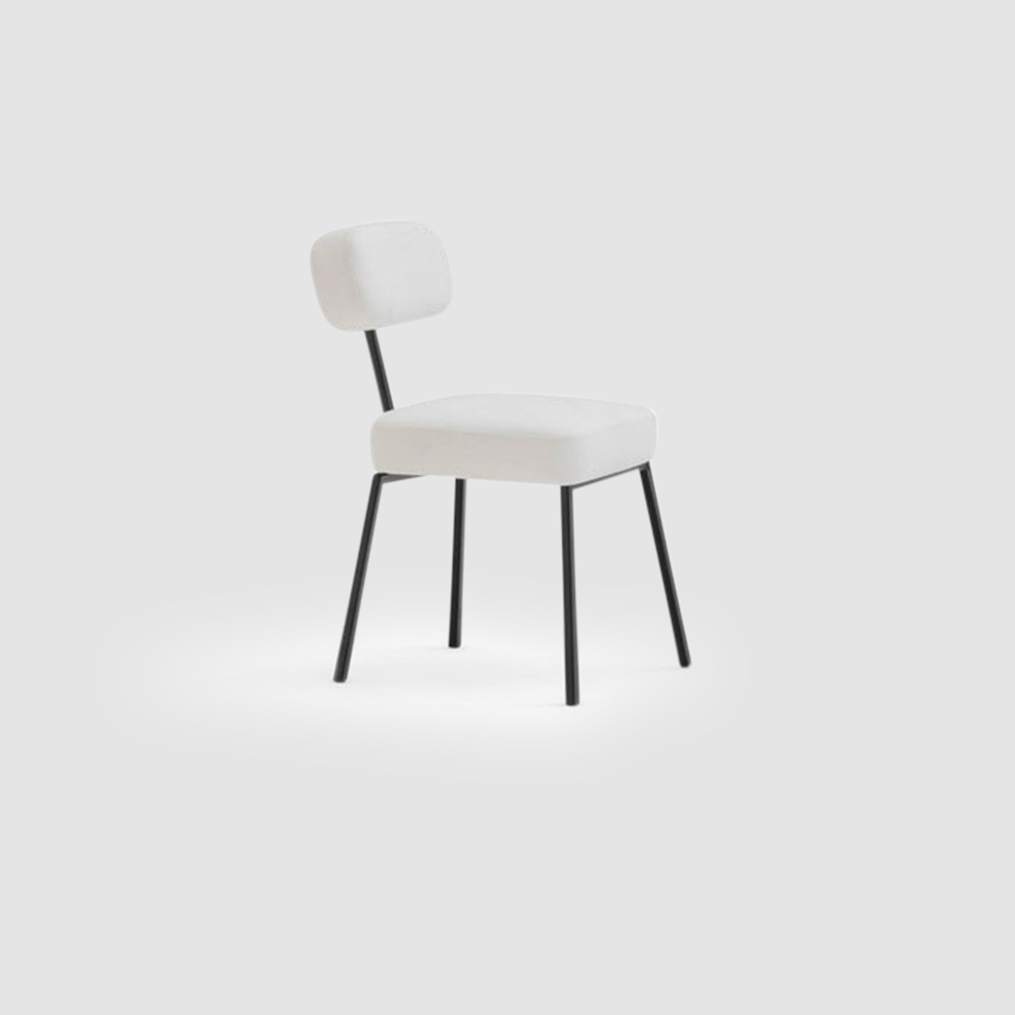 The Ida Dining Chair - minimalist design with a black steel frame and white cushioned seat and backrest, showcasing modern and ergonomic style.