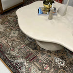 Load image into Gallery viewer, Detail of The Jamie Coffee Table’s micro plaster texture and smooth glass top – a high-end round center table with glass top offering timeless sophistication.
