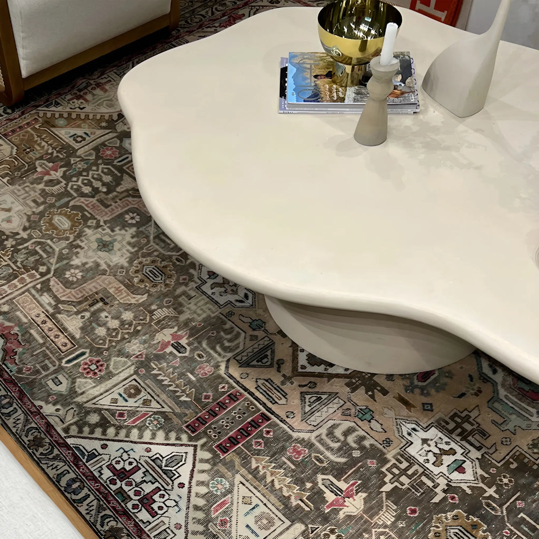 Detail of The Jamie Coffee Table’s micro plaster texture and smooth glass top – a high-end round center table with glass top offering timeless sophistication.