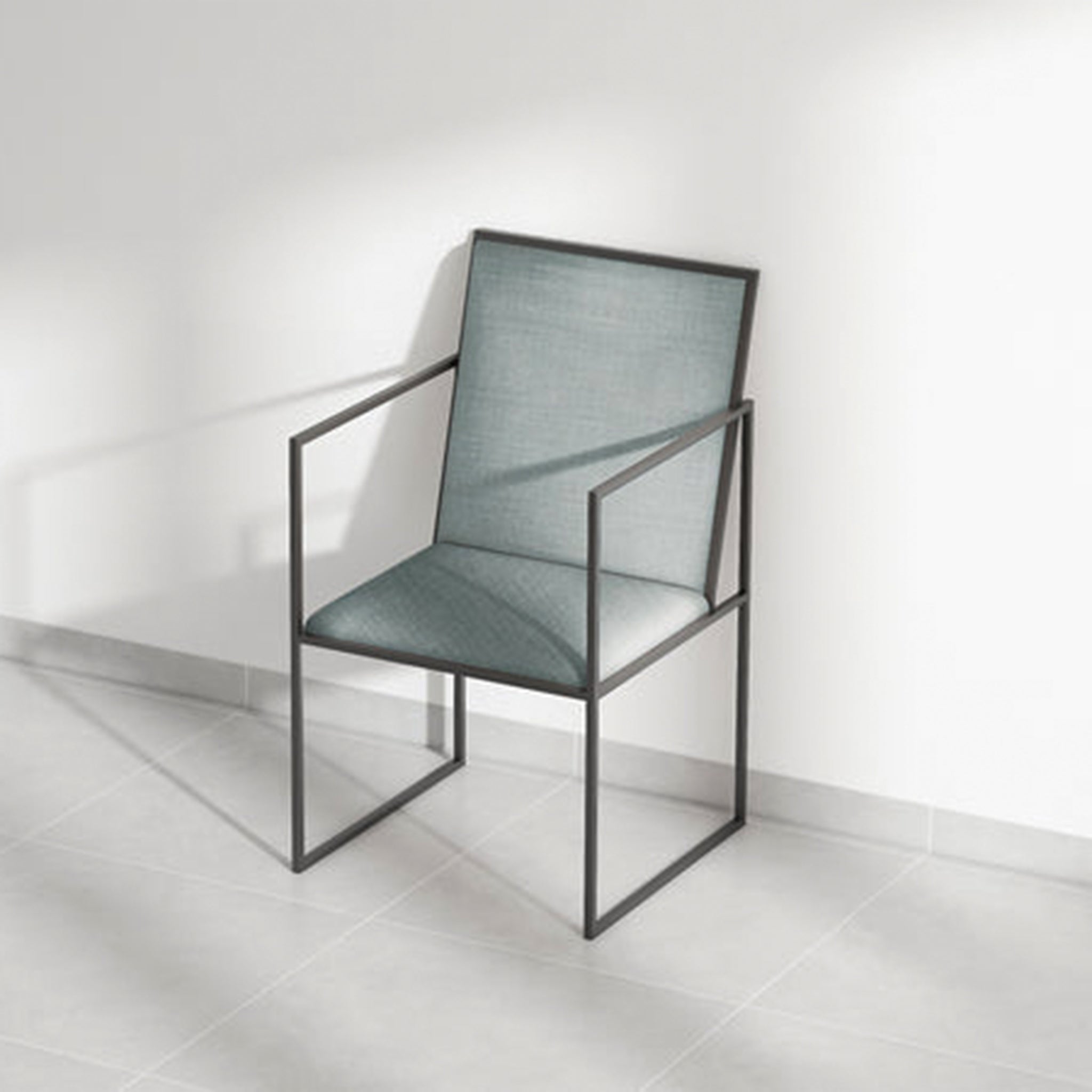 High-back dining chair with blue upholstery and metal arms