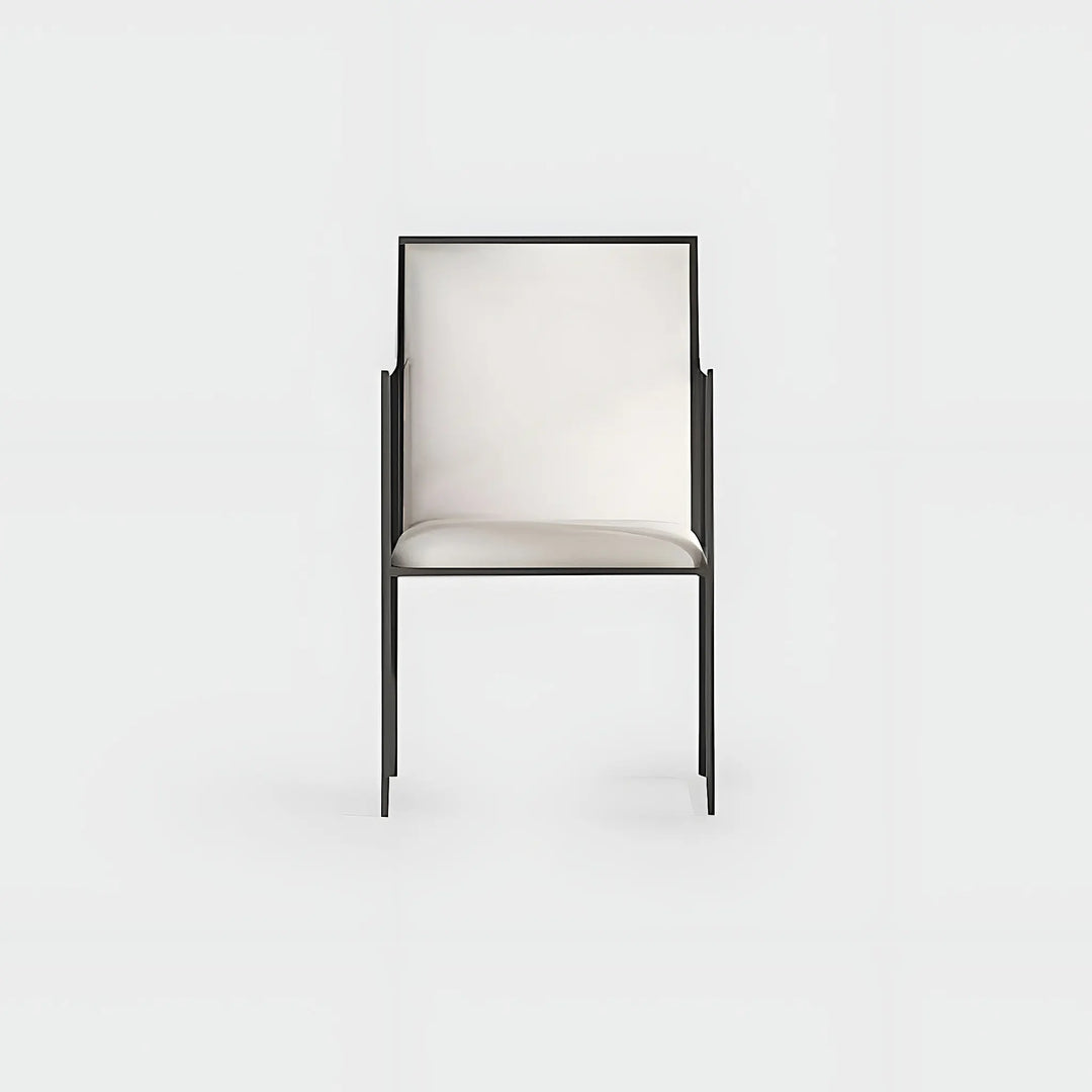 Elegant dining chair with iron legs, perfectly complementing a glass-top table in a contemporary setting.