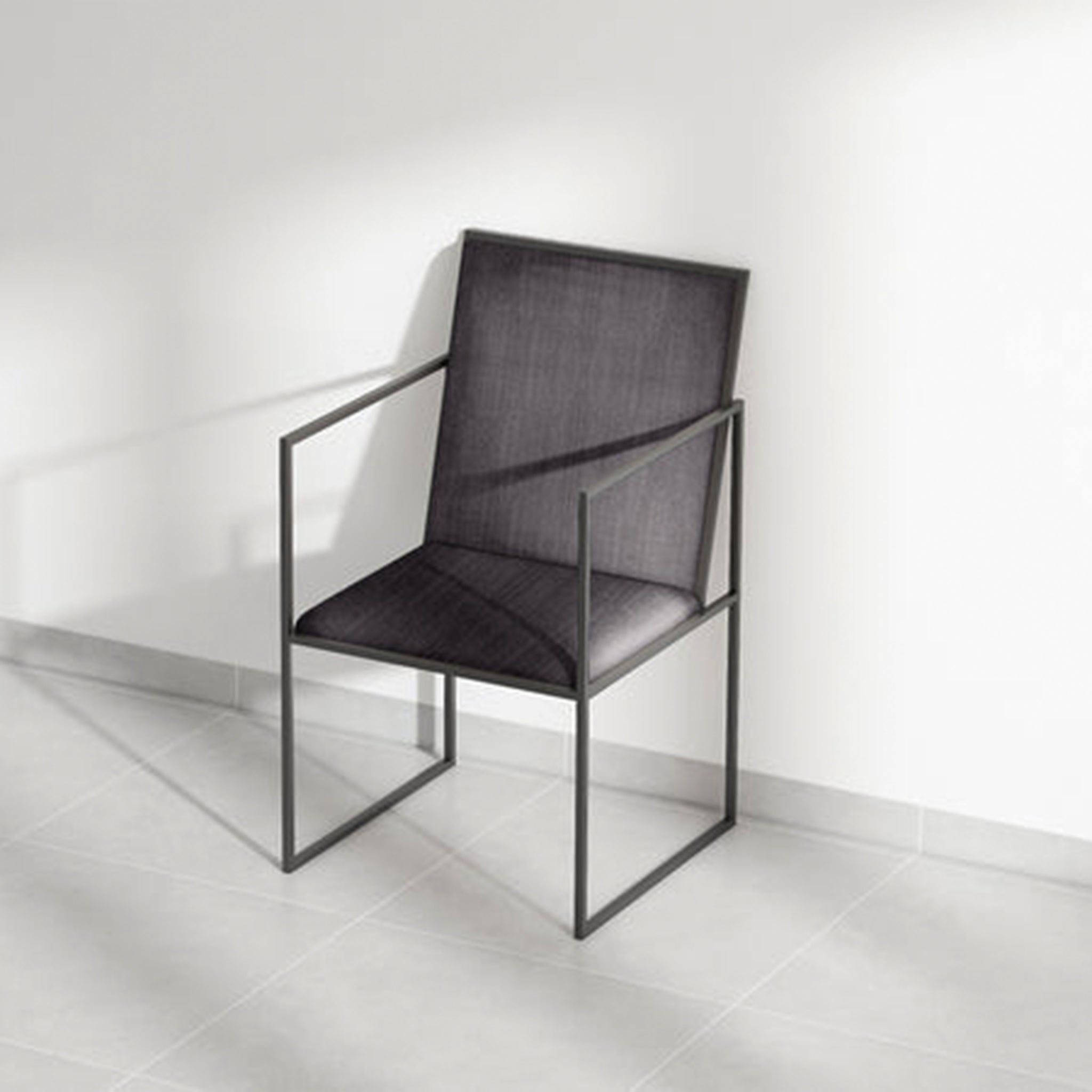 Minimalist dining chair with blue cushion and metal design