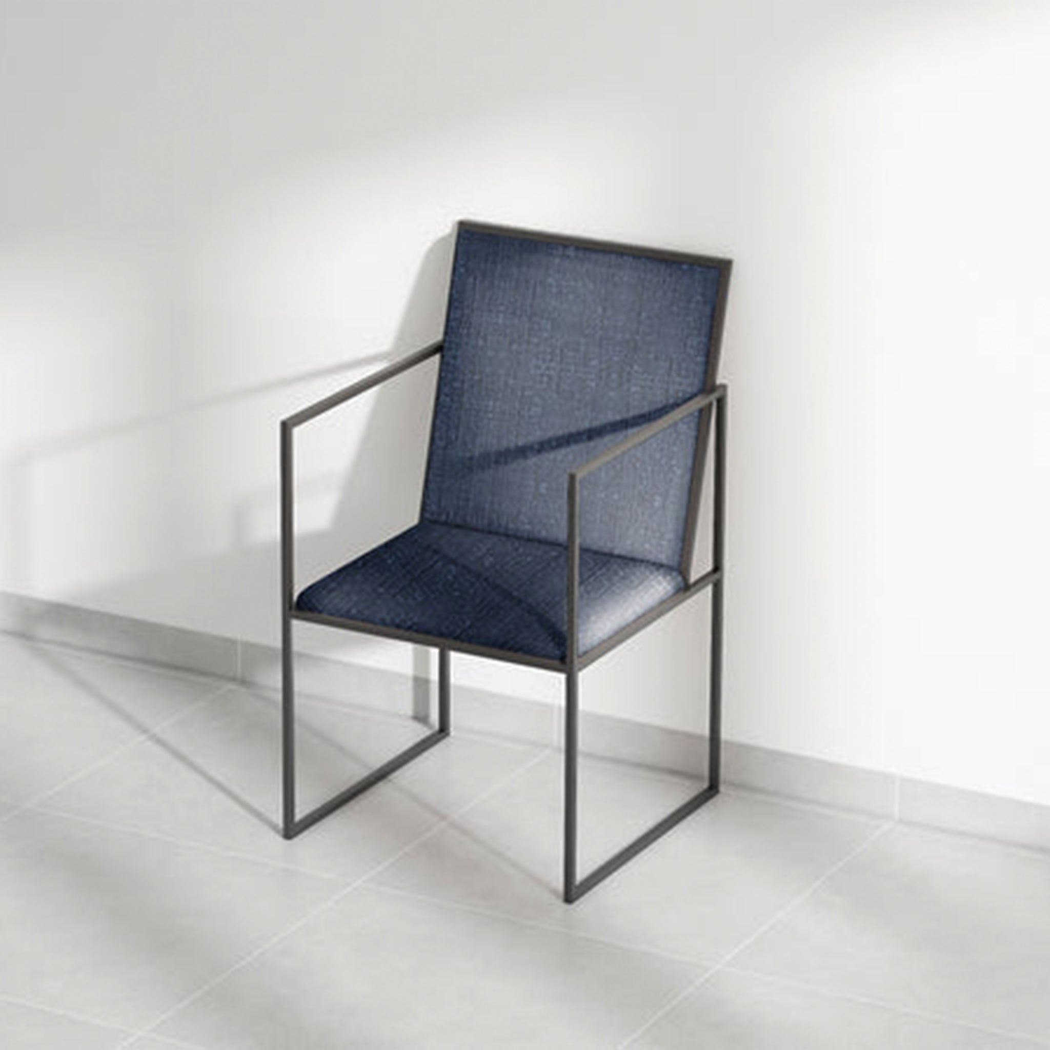 Designer dining chair with blue cushion and black metal frame