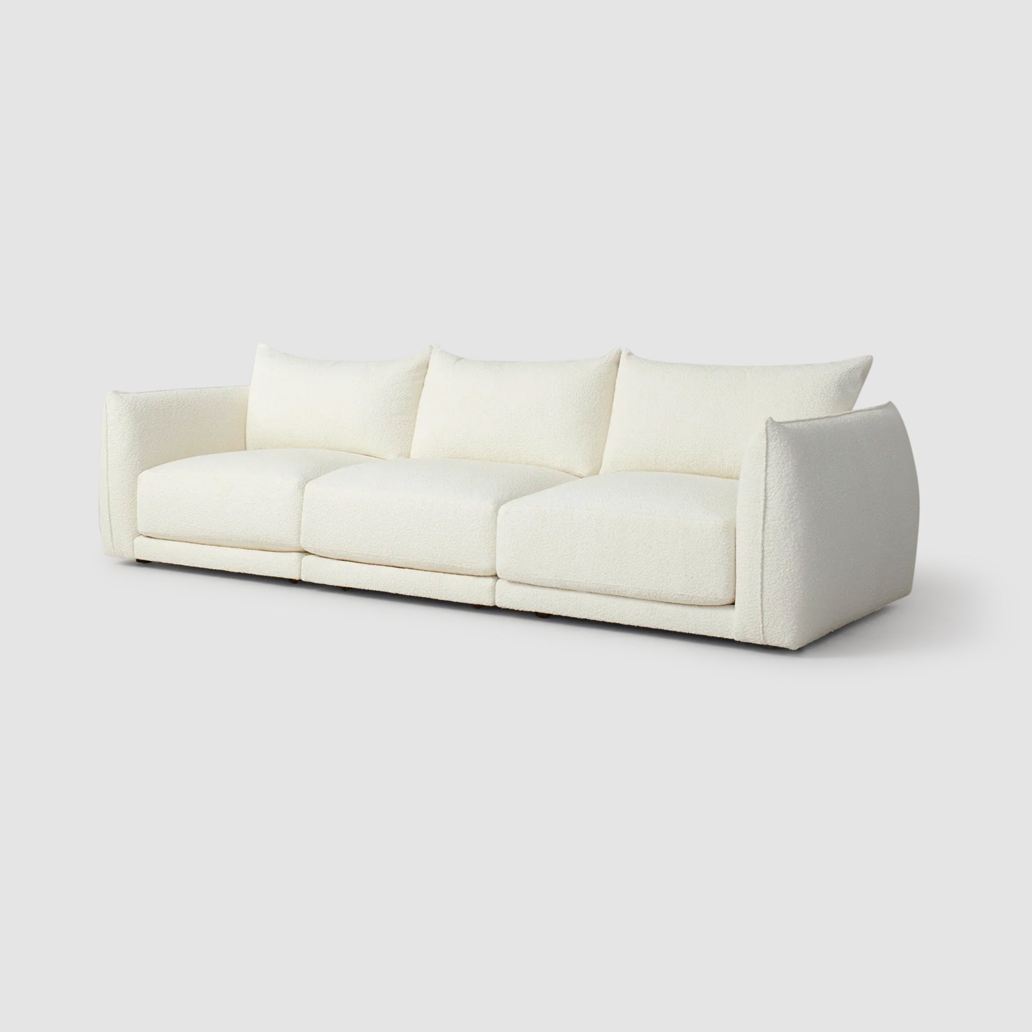 Side view of The Jules Sofa highlighting its plush cushions.modern 3 seater sofa