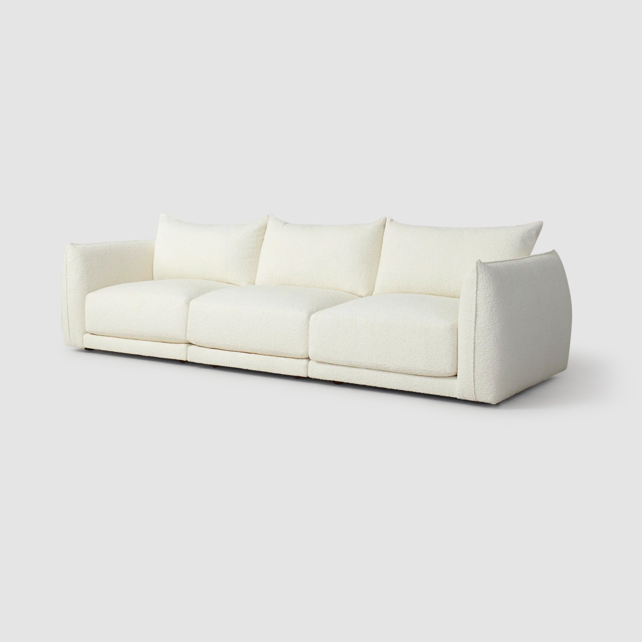 Side view of The Jules Sofa highlighting its plush cushions