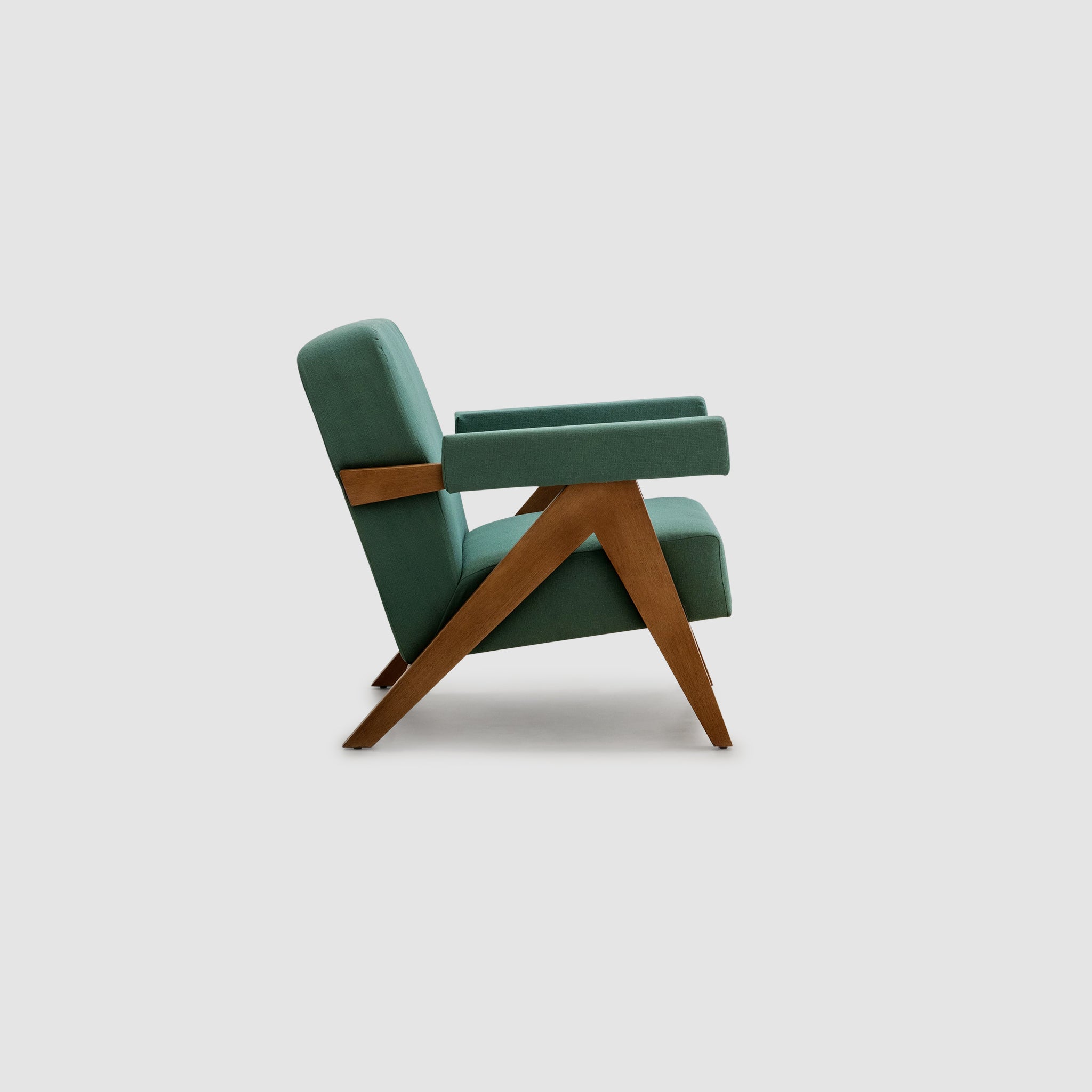 The Pierre Accent Chair in teal upholstery with a wooden frame, angled view.