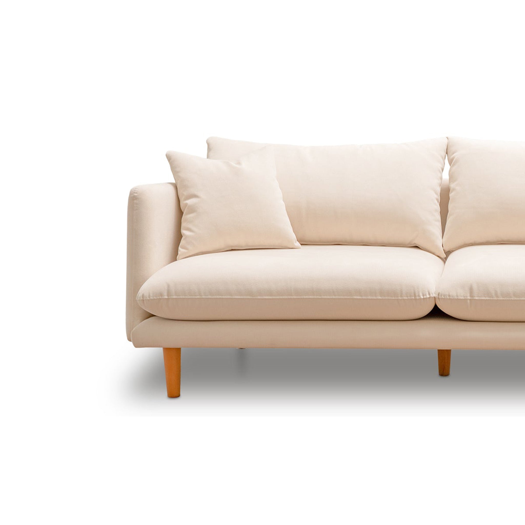 Close-up of a beige sofa with wooden legs and plush cushions, highlighting its modern design and comfortable seating.