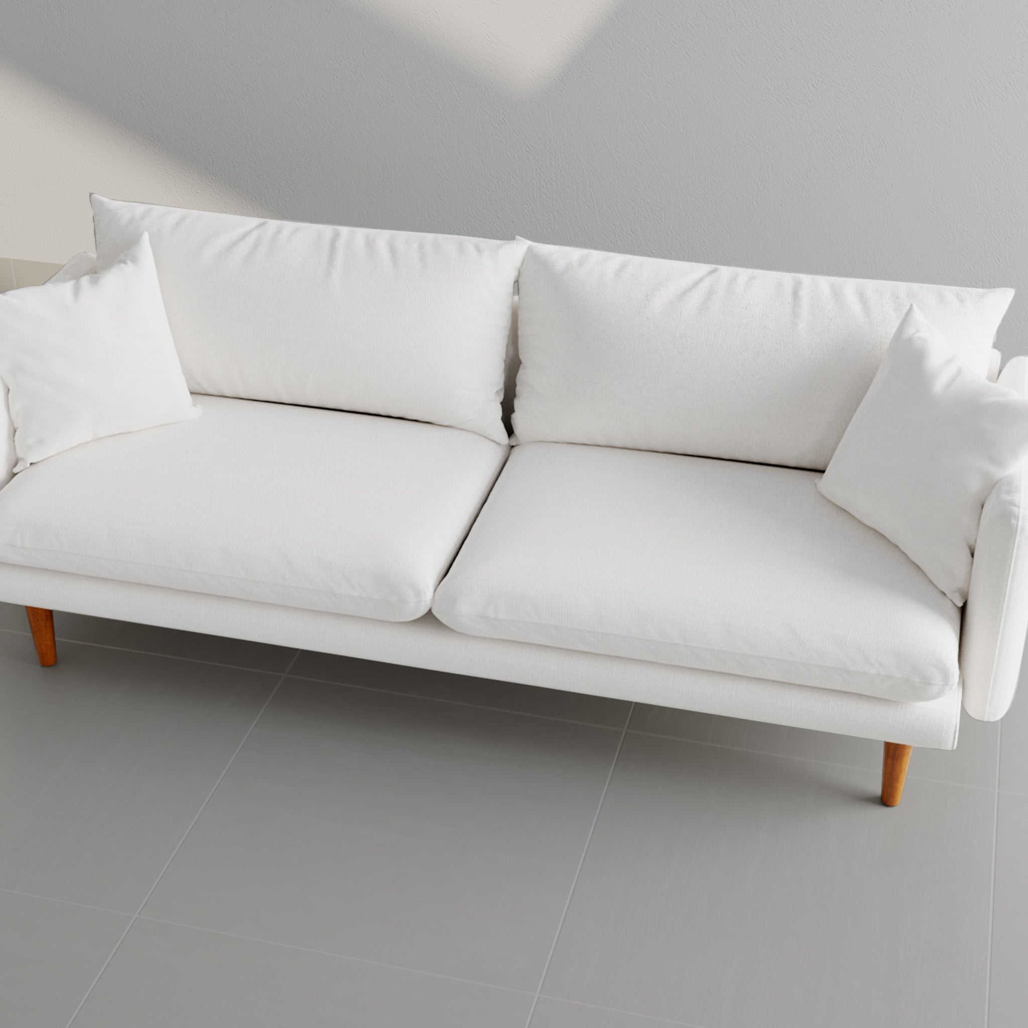 Top view of a sleek white sofa with soft cushions and wooden legs, ideal for modern living room decor.Premium Sofa Set