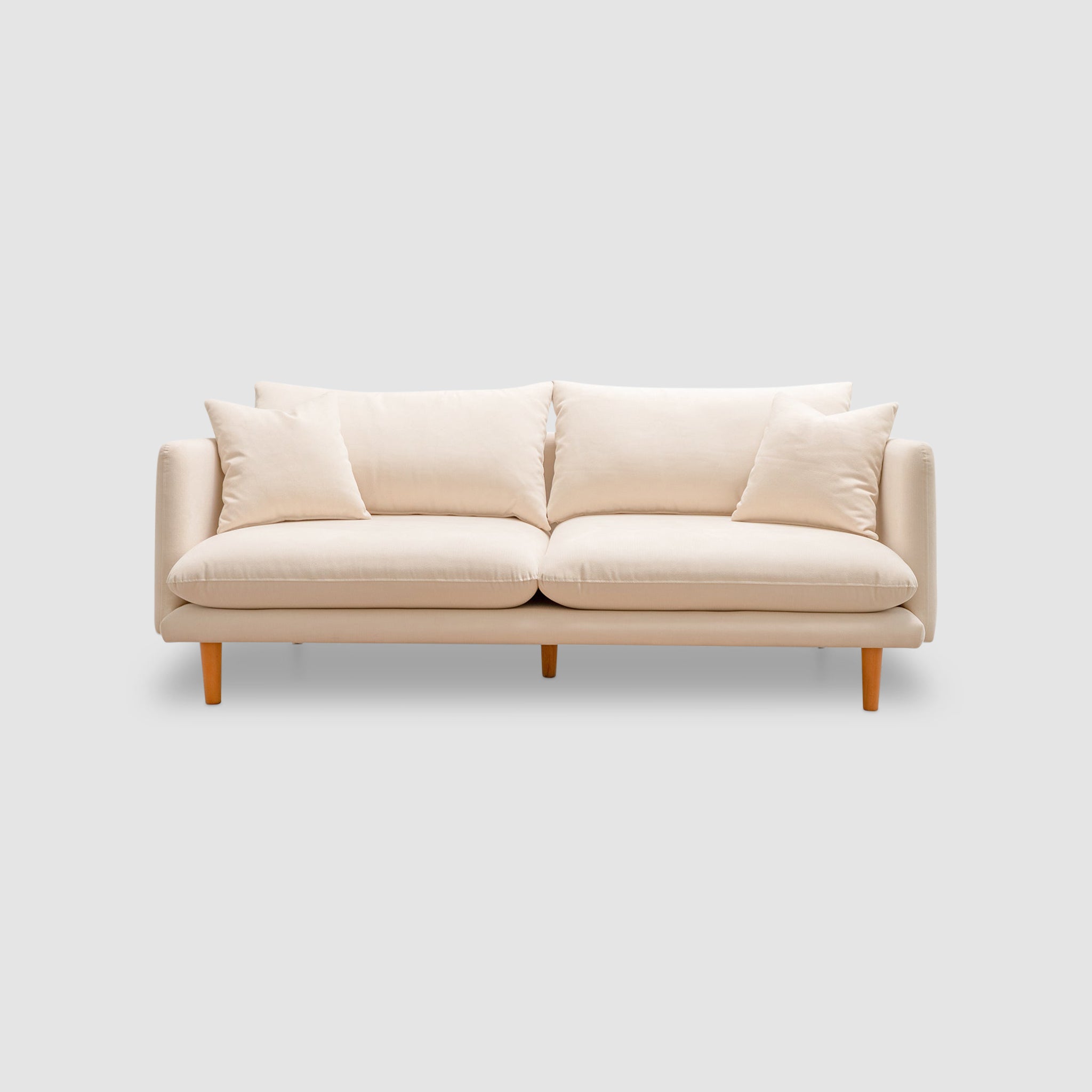 Contemporary beige sofa with wooden legs and plush cushions, offering a comfortable and stylish seating option for modern living rooms.