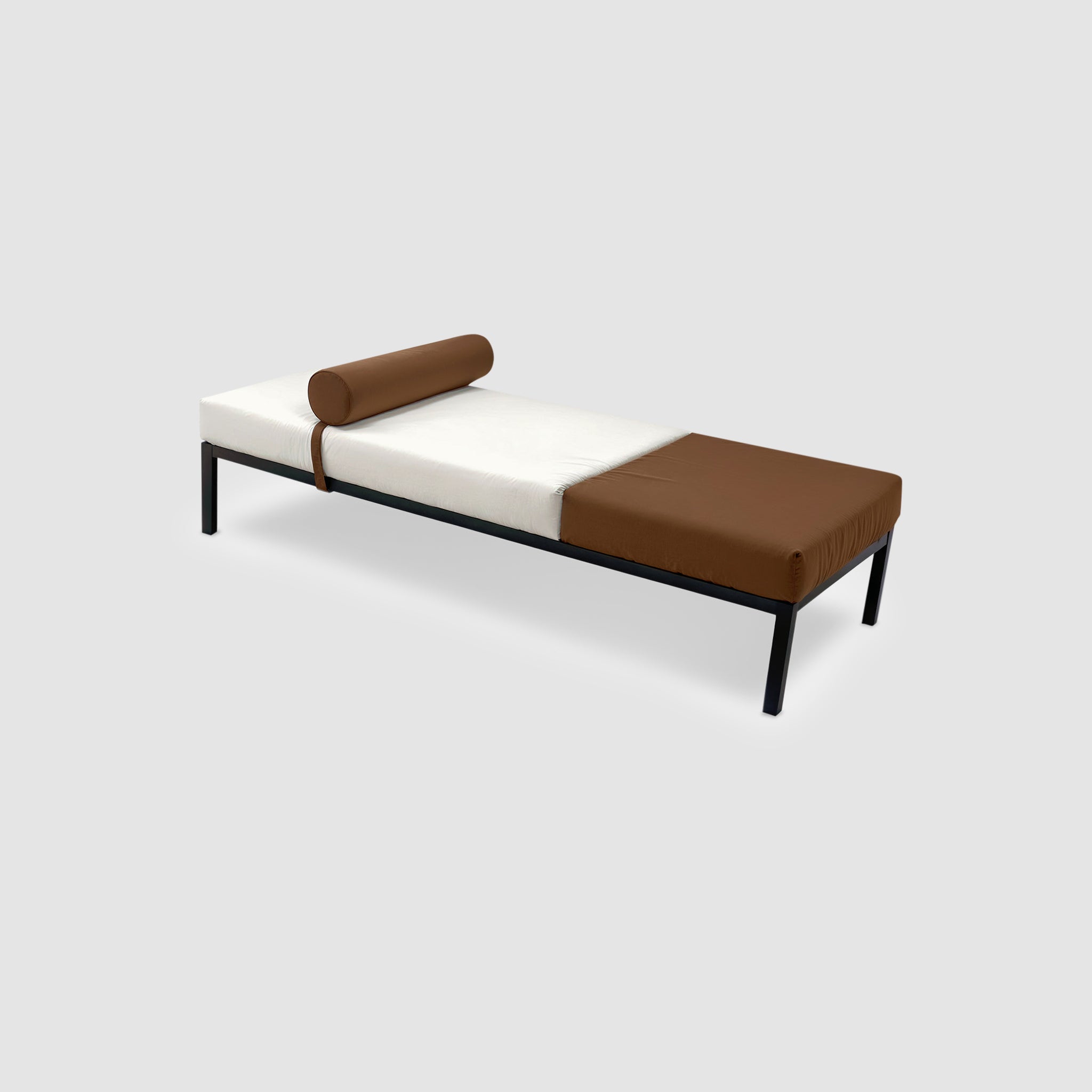 The Rodman Day Bed, featuring a classic midcentury design with a powder-coated steel frame, low seating, and minimalist appeal. The two-tone upholstery includes signature Vegan Leather and customizable fabric options. The bolster cushion is also in Vegan Leather and attaches with Velcro.