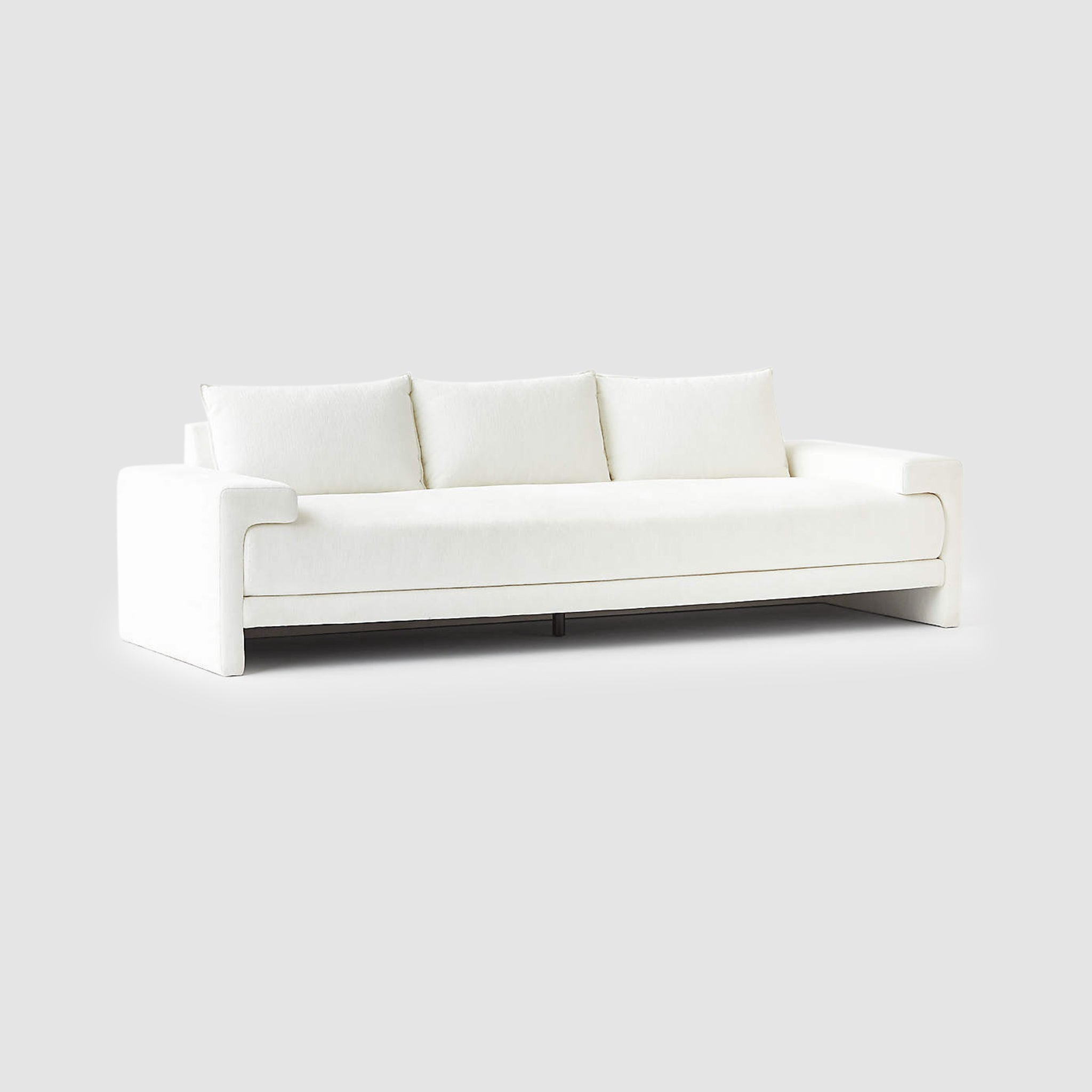 Modern minimalist white Sylvia sofa with plush cushions, clean lines, and contemporary design for a stylish living room