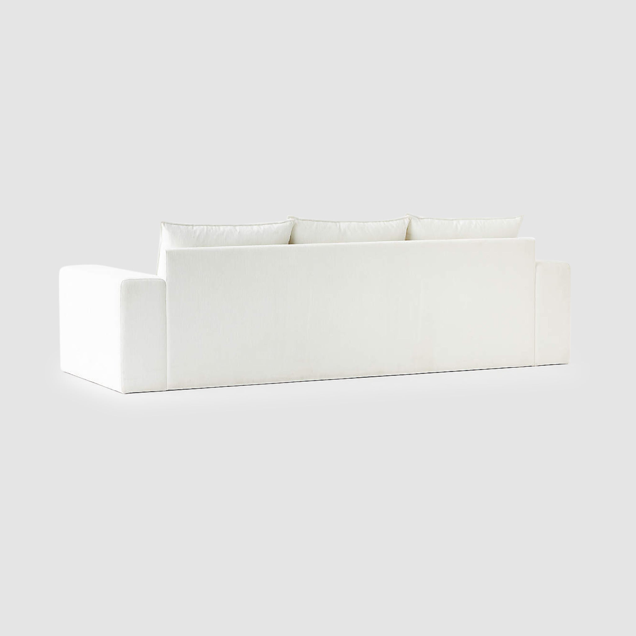Back view of modern minimalist white Sylvia sofa with plush cushions and sleek design for a stylish living room