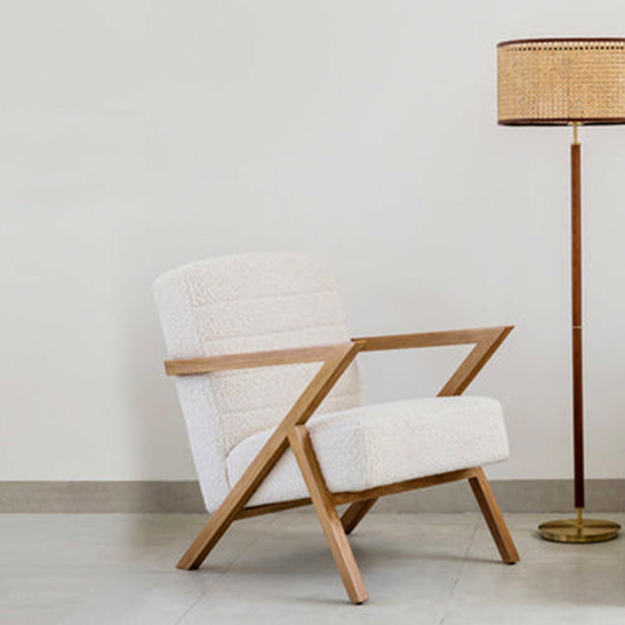 The Stanley accent chair featuring sleek wooden armrests
