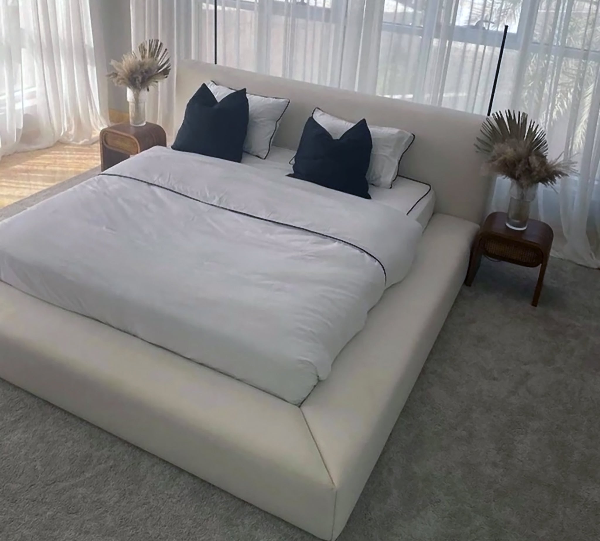 Light and airy bedroom showcasing the Stella bed with a tufted headboard. Easy care platform bed in a calming retreat.